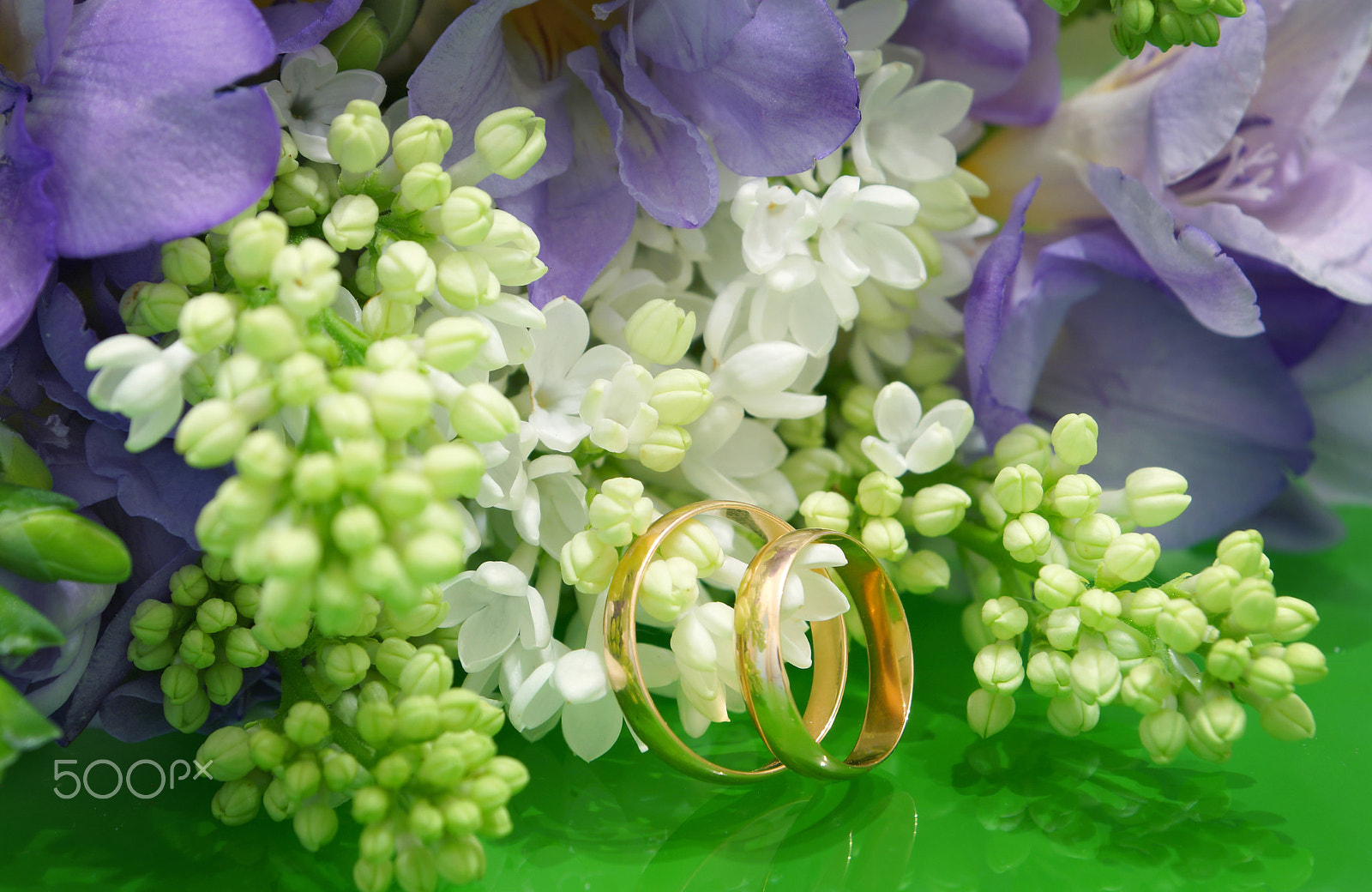 Sony SLT-A65 (SLT-A65V) sample photo. Two wedding rings and a wedding bouquet of white lilac and purple freesias photography