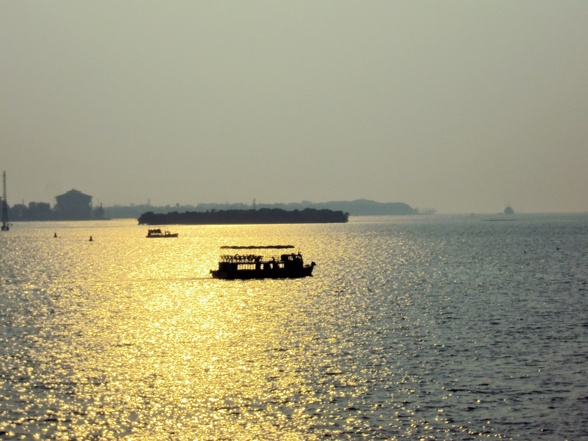 Sony DSC-W180 sample photo. Boat in golden water photography