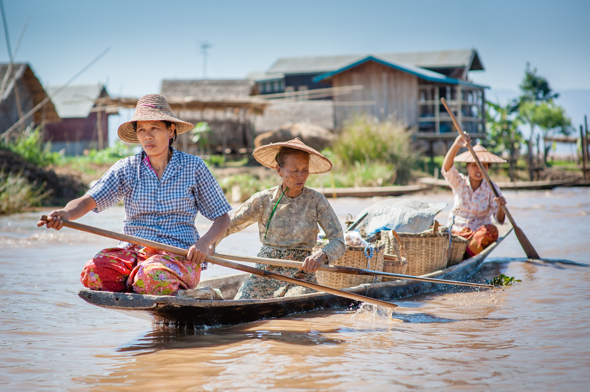 Nikon D700 + Sigma 85mm F1.4 EX DG HSM sample photo. Women paddling on boat photography