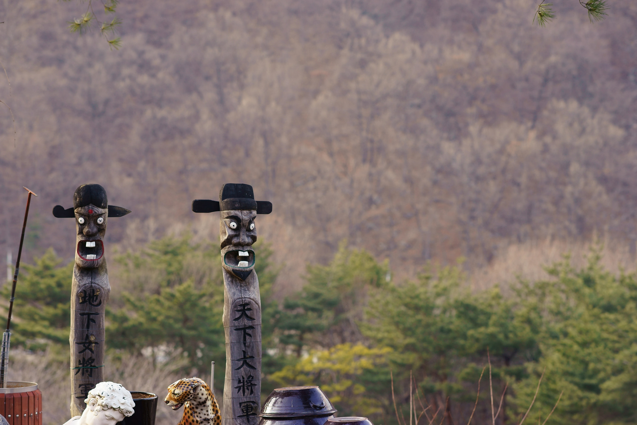 Sony a7 II + Sony Sonnar T* 135mm F1.8 ZA sample photo. Korean traditional totem pole at the village entrance photography