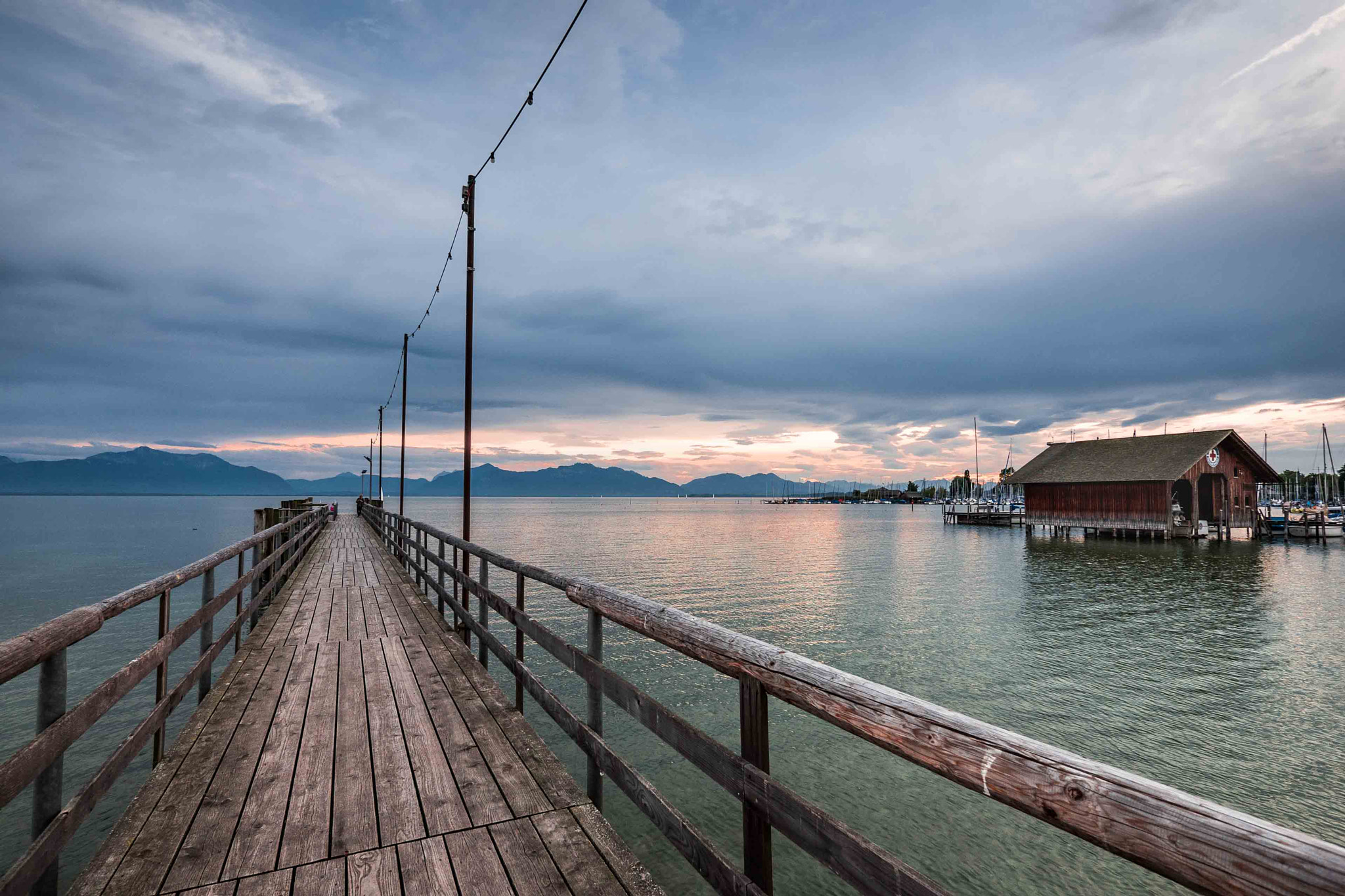 Panasonic Lumix DMC-GH4 + Panasonic Lumix G Vario 7-14mm F4 ASPH sample photo. Chiemsee sunset photography