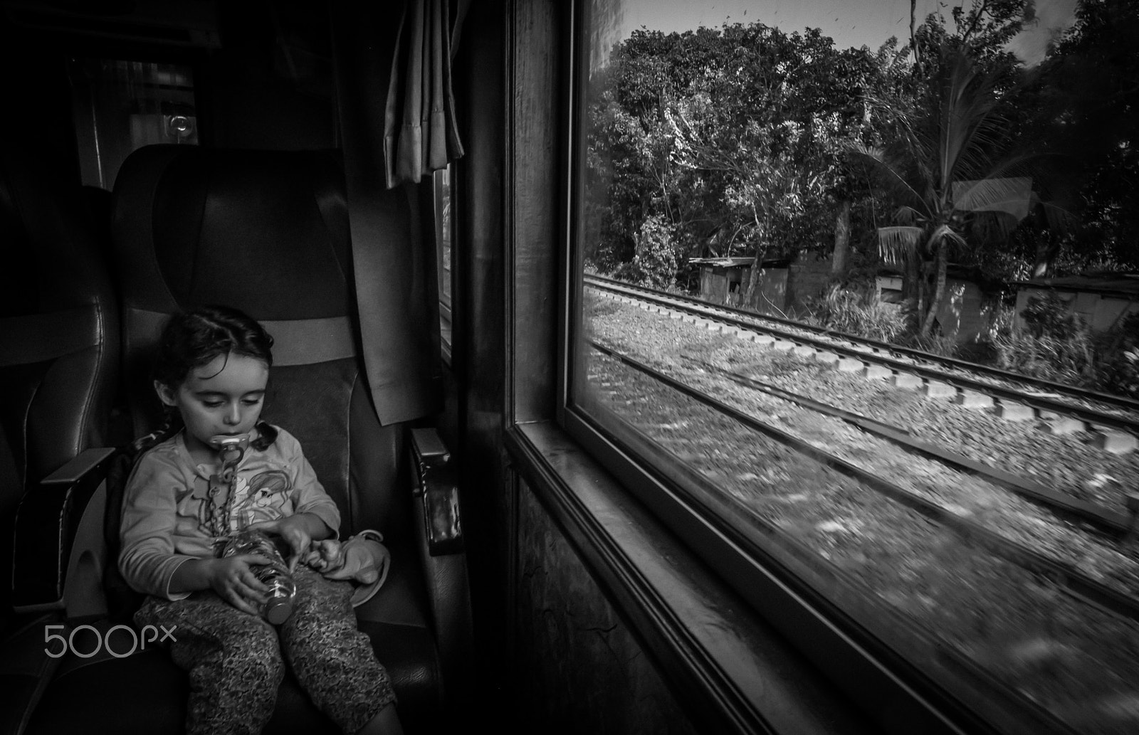 Fujifilm XF 14mm F2.8 R sample photo. Portrait in train photography