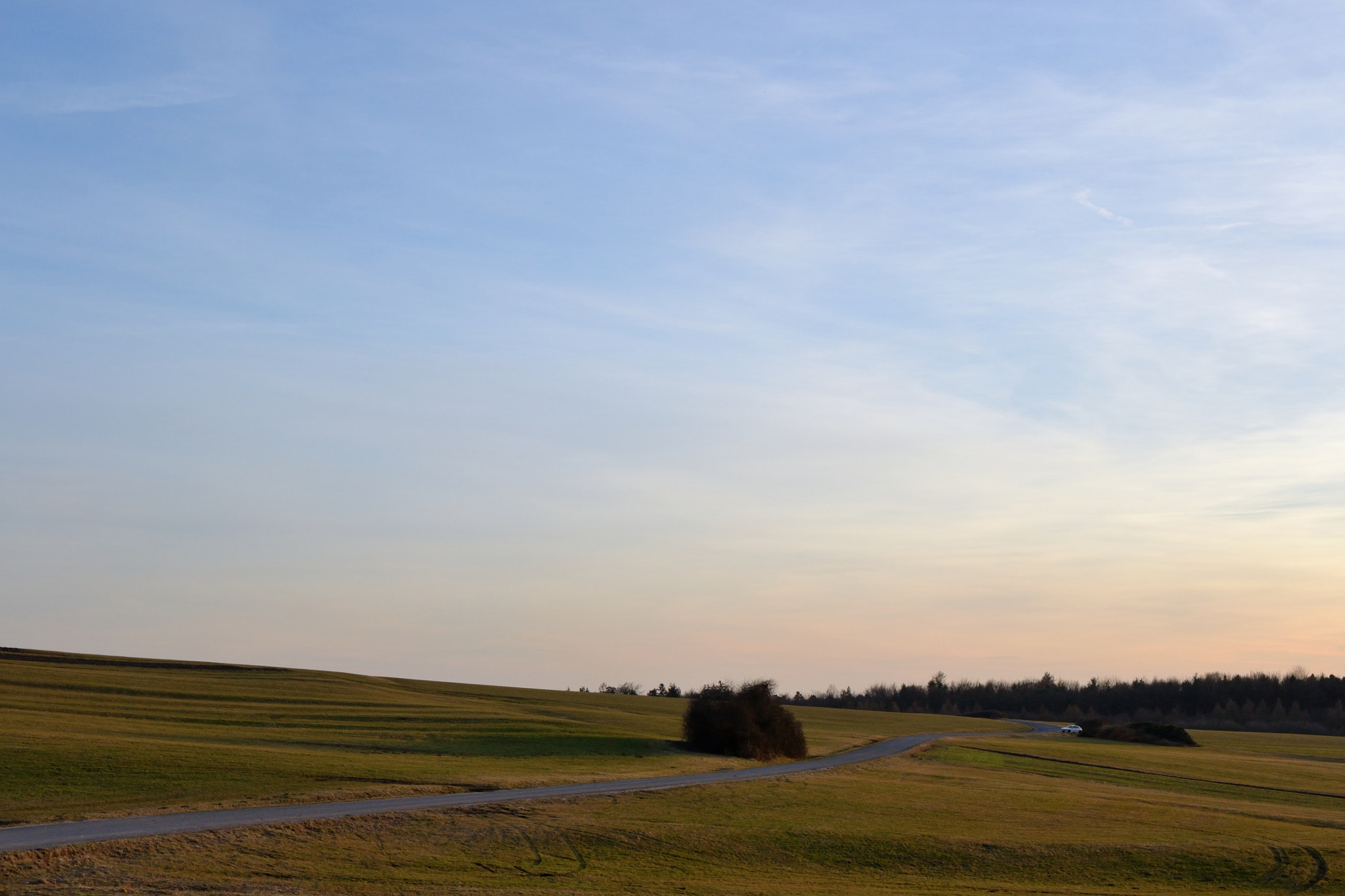 Nikon D3100 + Nikon AF-S Nikkor 18-35mm F3.5-4.5G ED sample photo. Across the hills photography