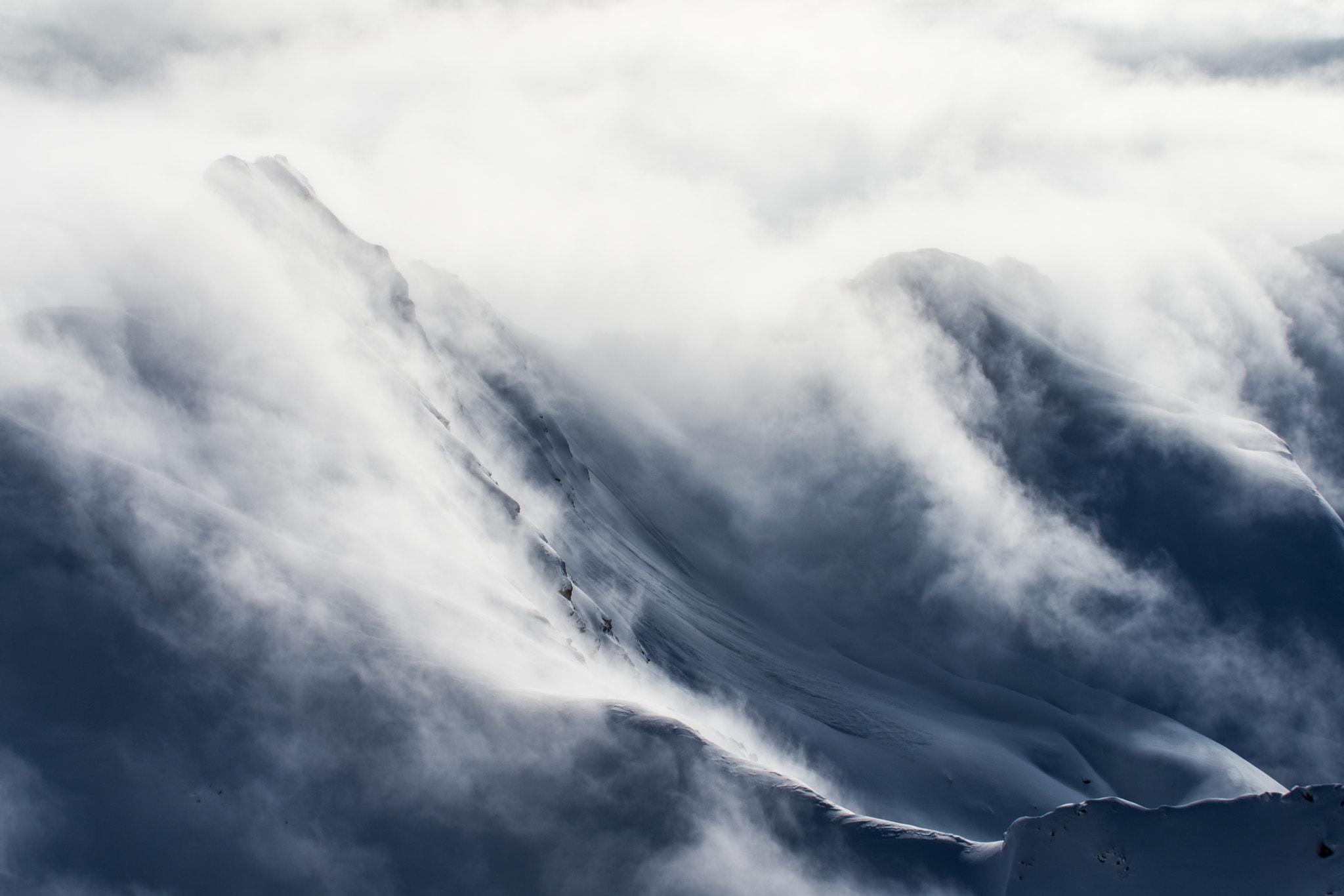Nikon D600 + Tamron SP AF 70-200mm F2.8 Di LD (IF) MACRO sample photo. Clouds moving over snowy mountains photography
