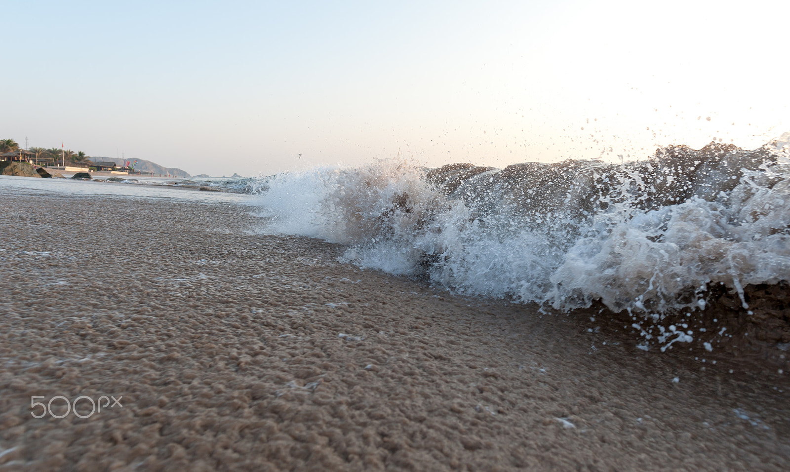 Nikon D700 sample photo. Ocean waves in light of a rising sun  / photography