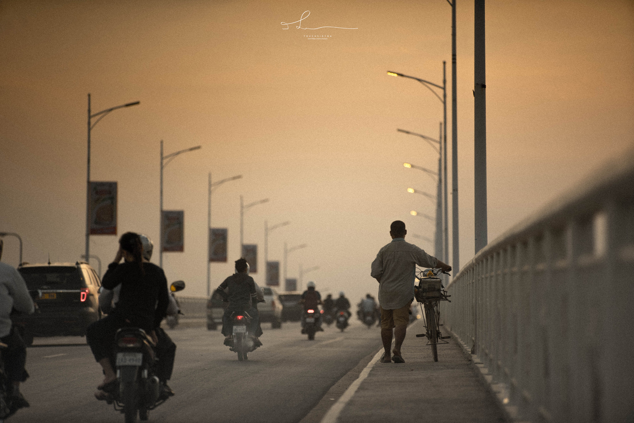 Sony a7 II + Sony DT 50mm F1.8 SAM sample photo. A man walking a bike photography