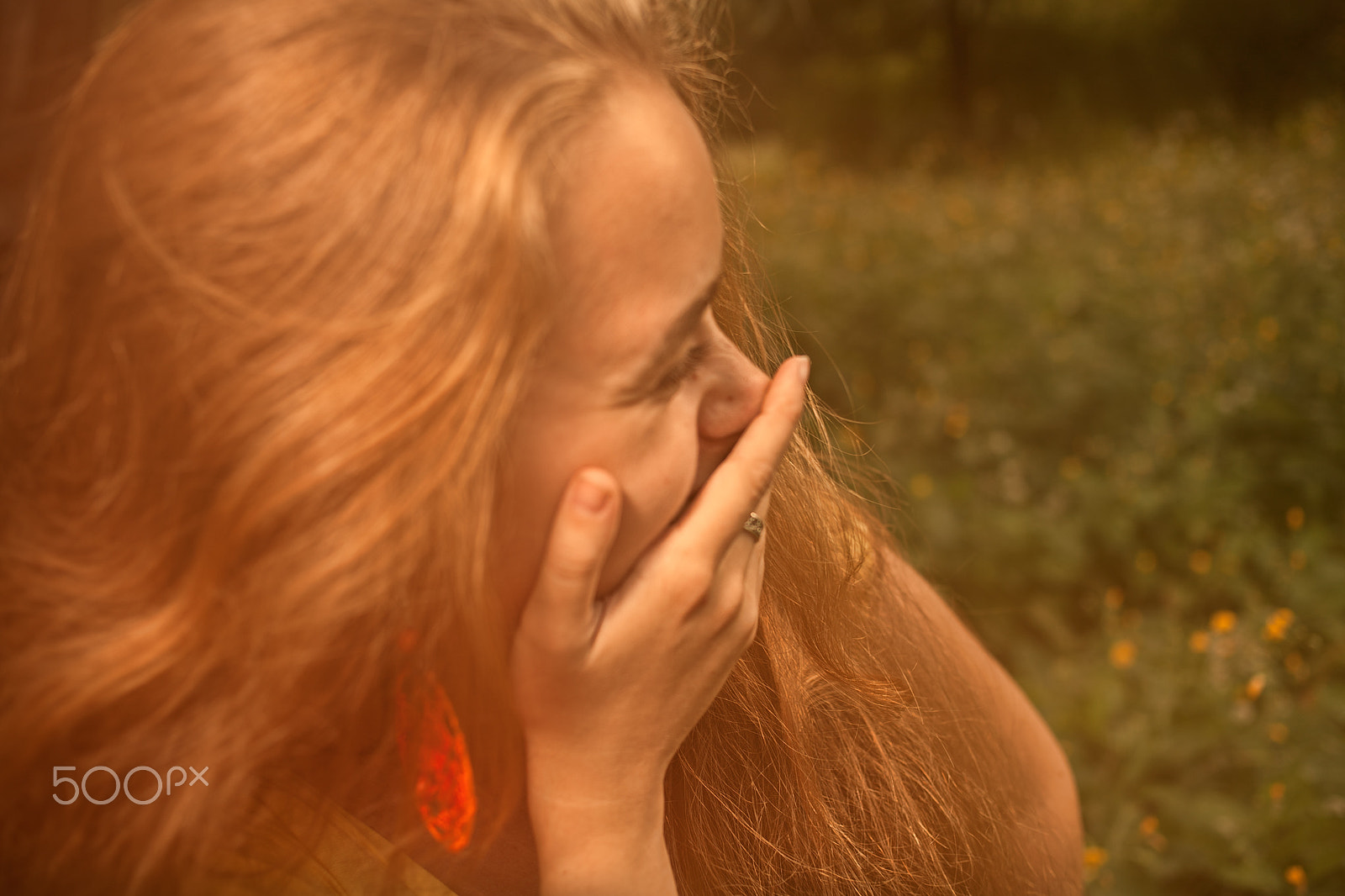 Canon EOS 5D + Canon EF 35mm F2 sample photo. Blond haired girl hiding her smile by hand and looking away photography