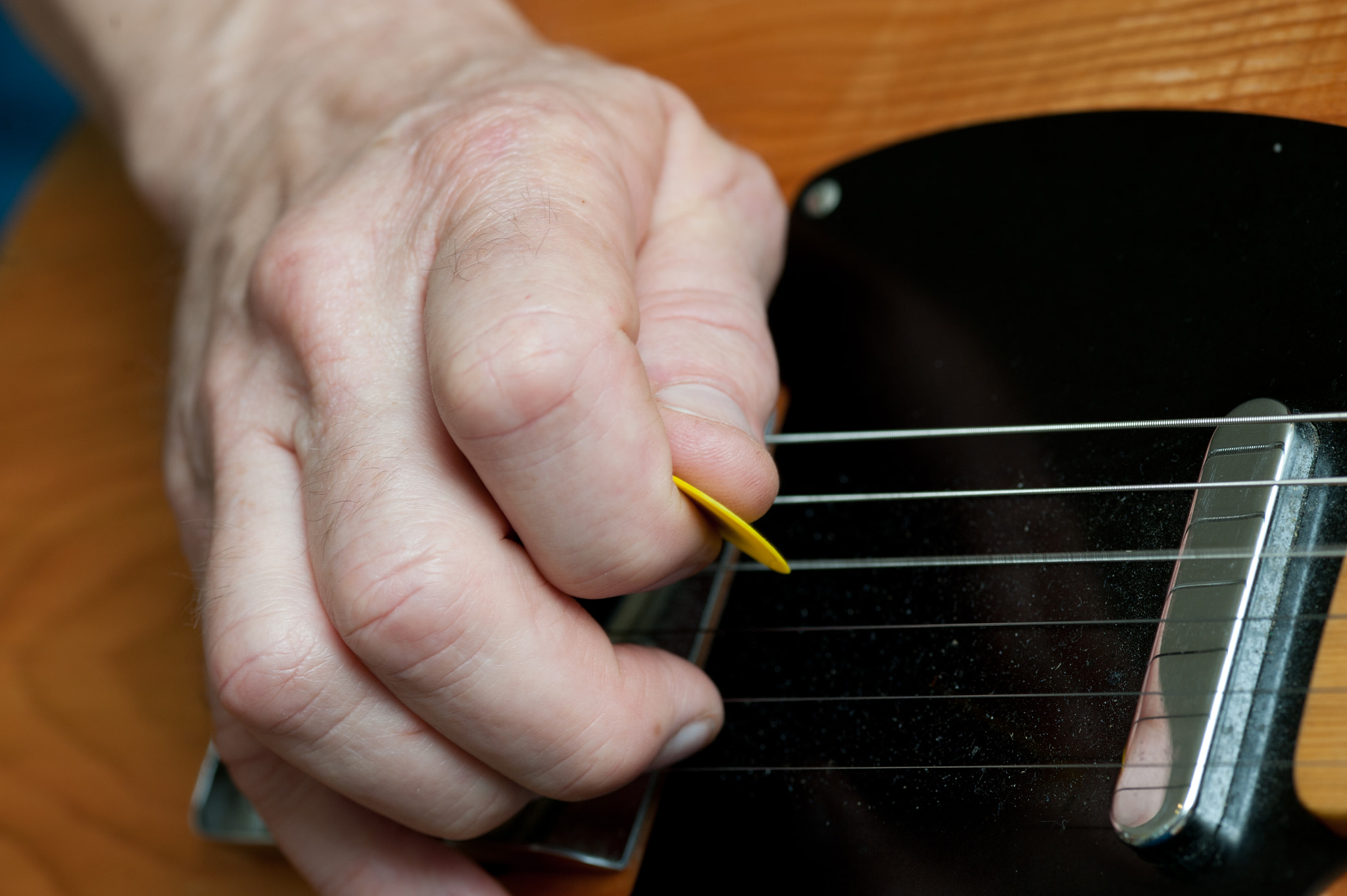 ZEISS Makro-Planar T* 100mm F2 sample photo. Hands playing a telecaster electric guitar photography