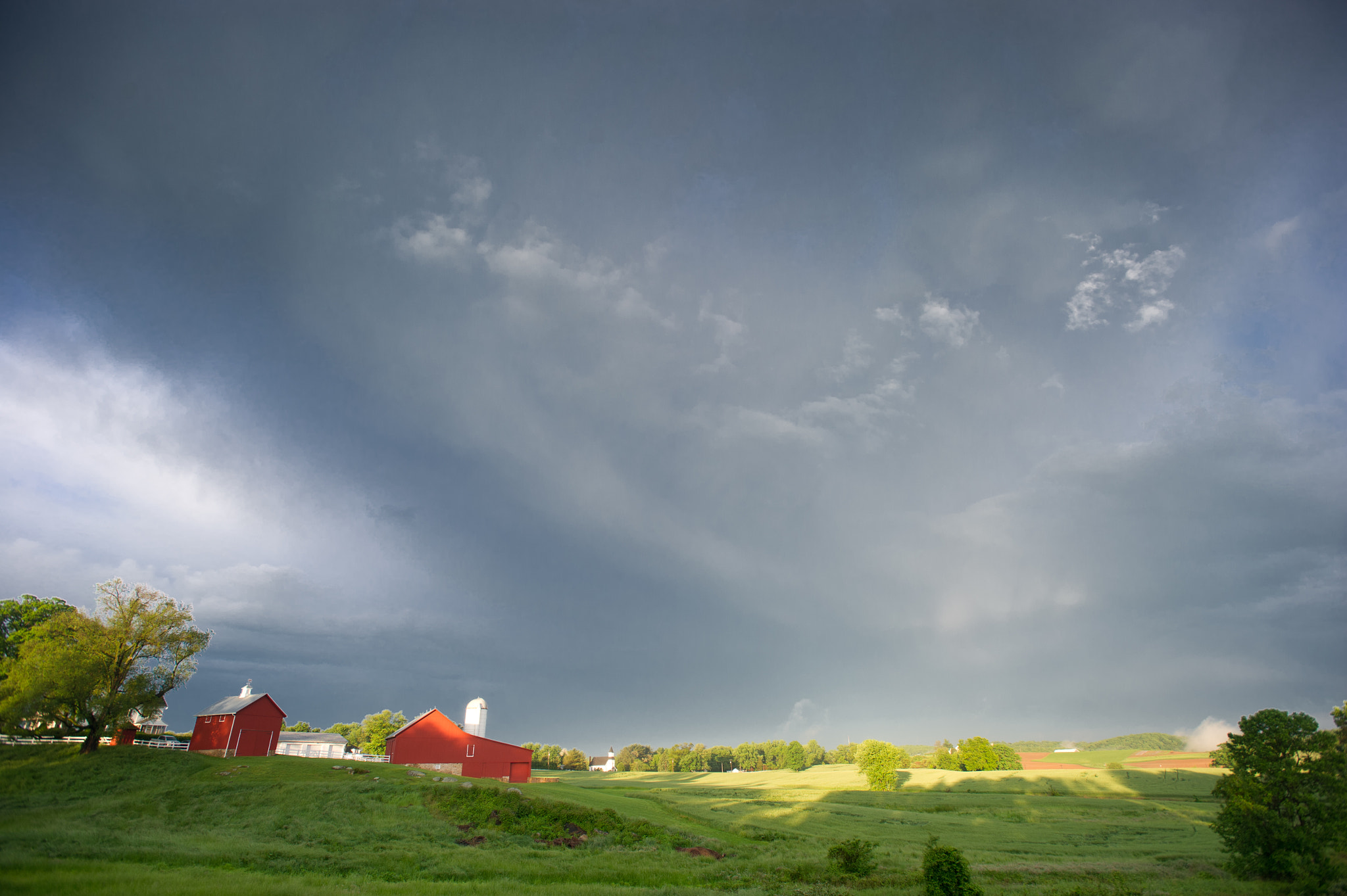 Nikon AF-S Nikkor 17-35mm F2.8D ED-IF sample photo. Stormy sky over farm landscape photography