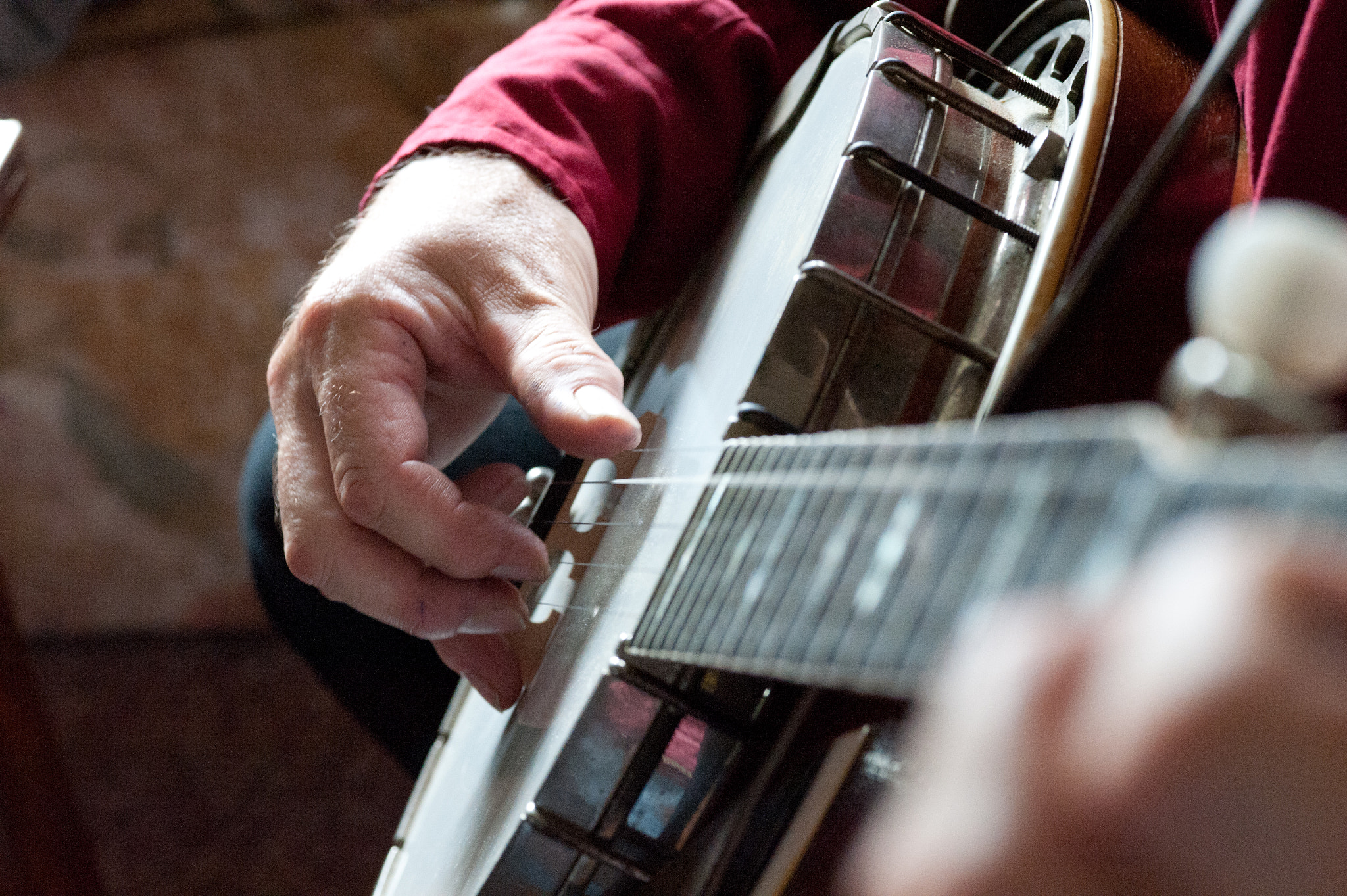 ZEISS Makro-Planar T* 100mm F2 sample photo. Hand of dave reed playing the banjo photography