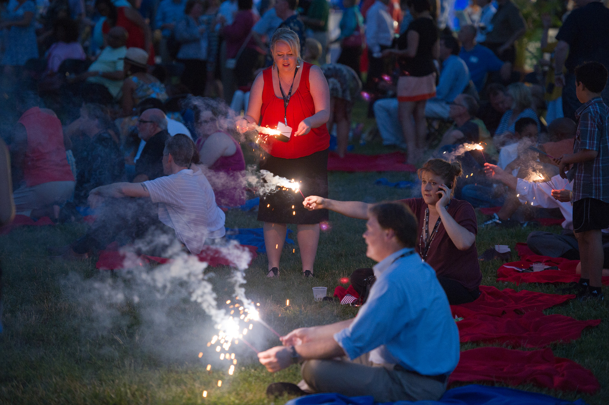 Nikon D3S sample photo. People with sparklers at outdoor event photography