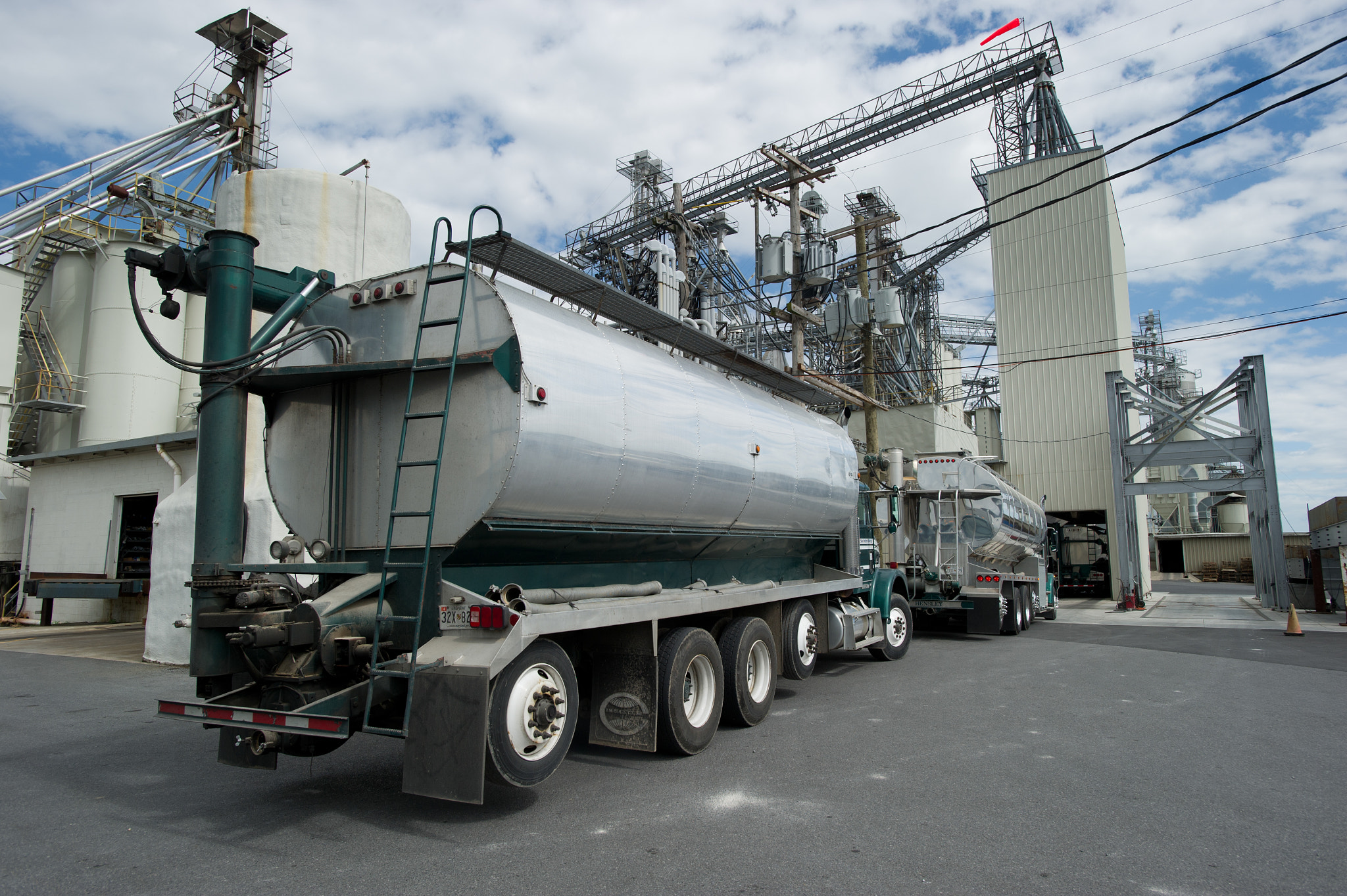 Nikon AF-S Nikkor 17-35mm F2.8D ED-IF sample photo. Truck pulling into a grain elevator photography