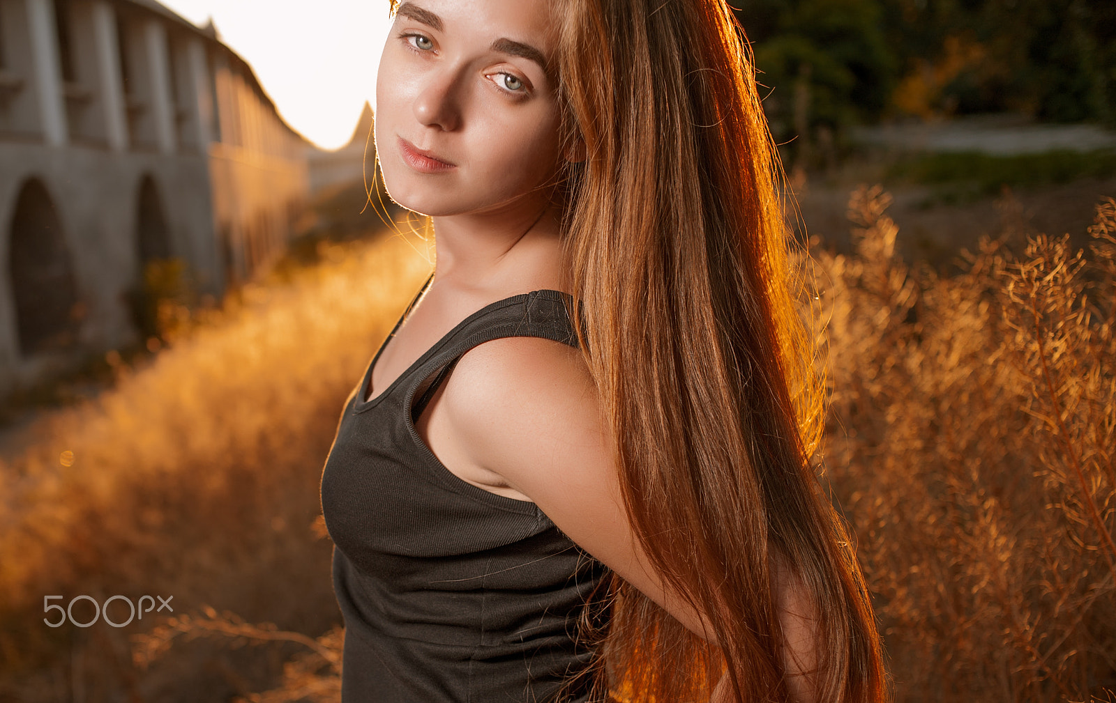Canon EOS 5D sample photo. Young woman n calm state of mind with long blond hair backlit by sun selective focus toned image,... photography