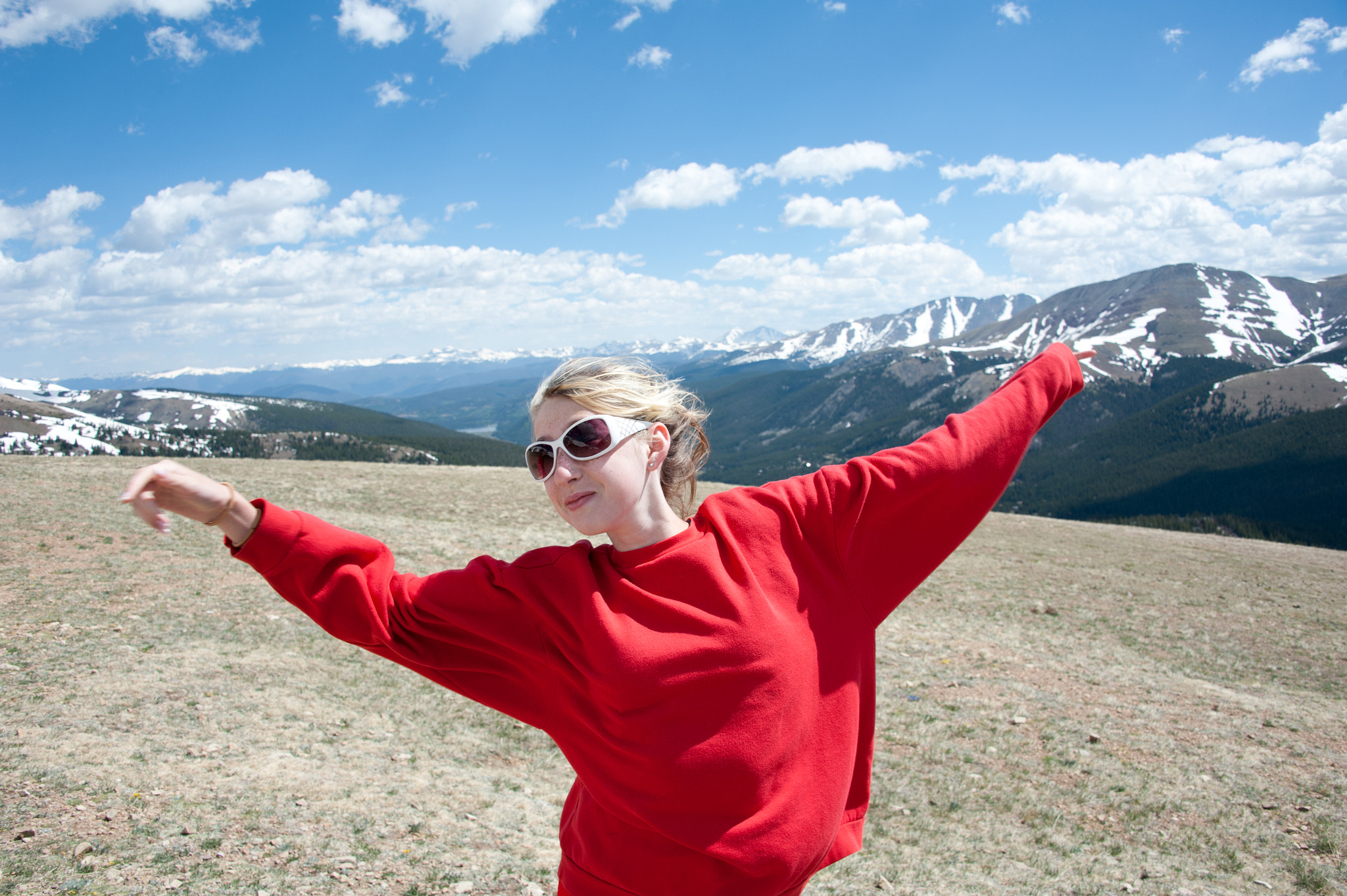 Nikon D700 sample photo. Young girl stretching arms in breeze on mountain side of colorado mountains photography