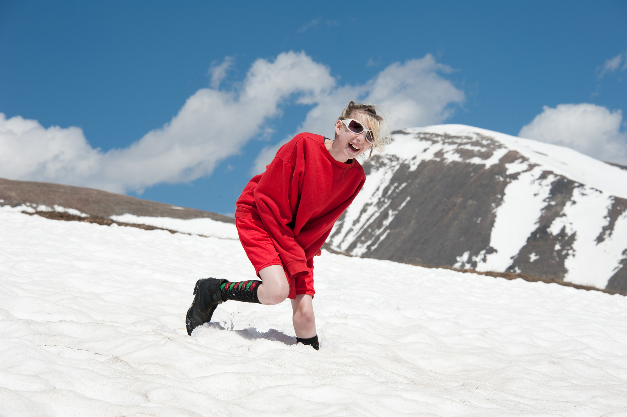Nikon D700 sample photo. Young girl laughing on mountain side of colorado mountains photography