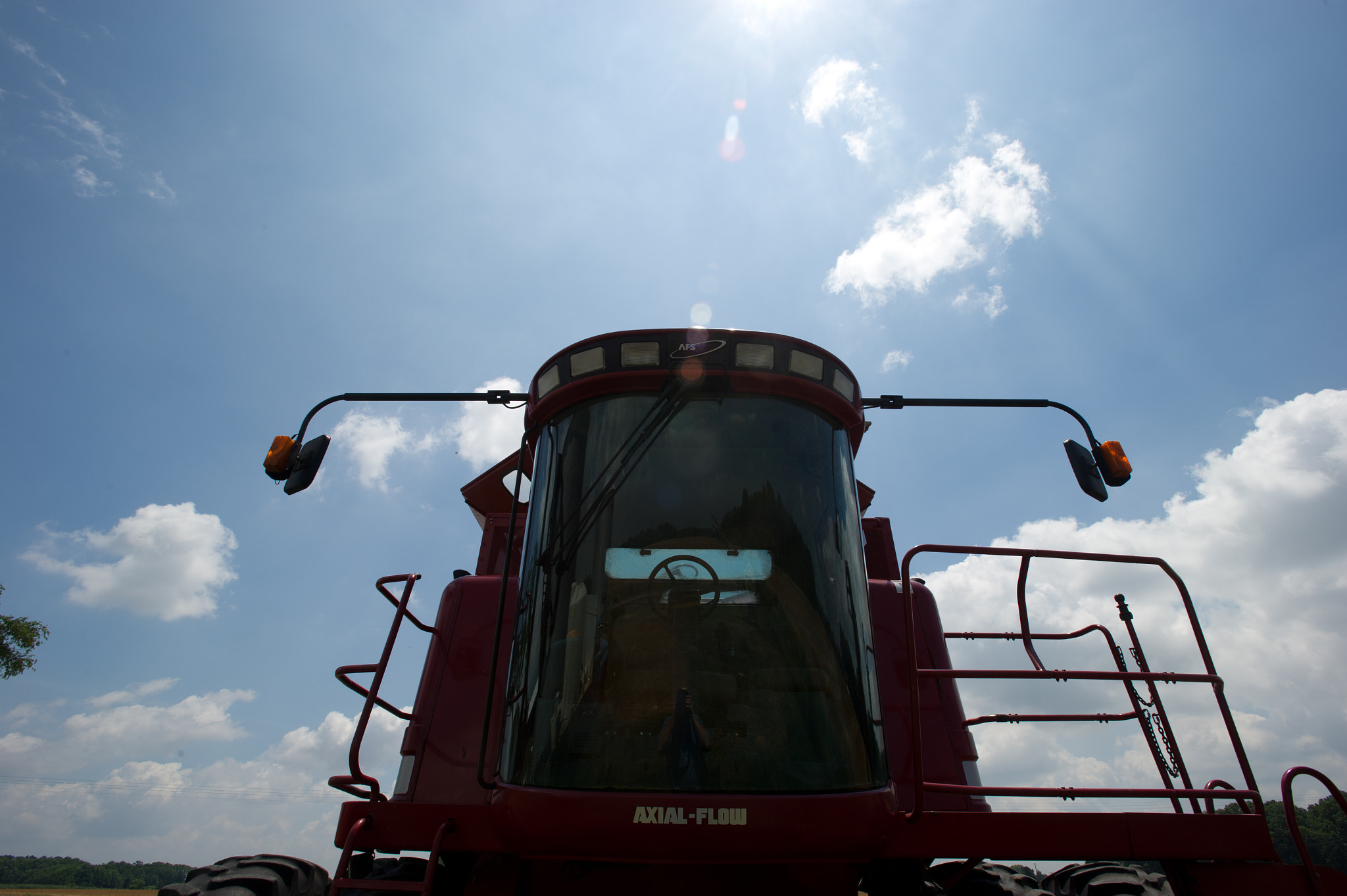 Nikon D3S + Nikon AF-S Nikkor 17-35mm F2.8D ED-IF sample photo. Grain production machinery on farm photography