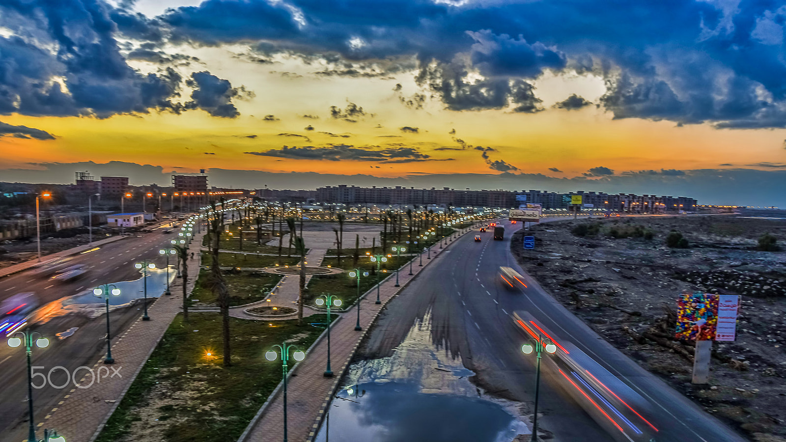 Nikon D7200 + Sigma 18-50mm F2.8 EX DC Macro sample photo. City gate after sunset rainy day photography