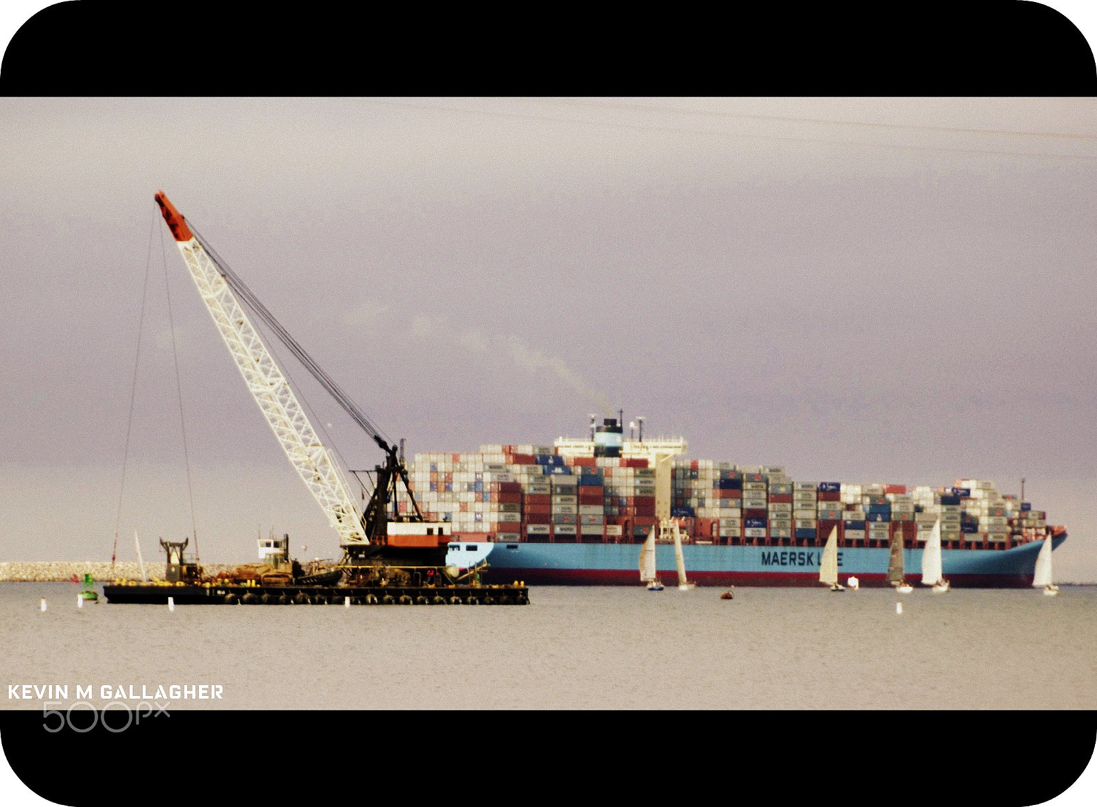 Nikon D70s sample photo. Cargo ship sailboats and a crane o photography
