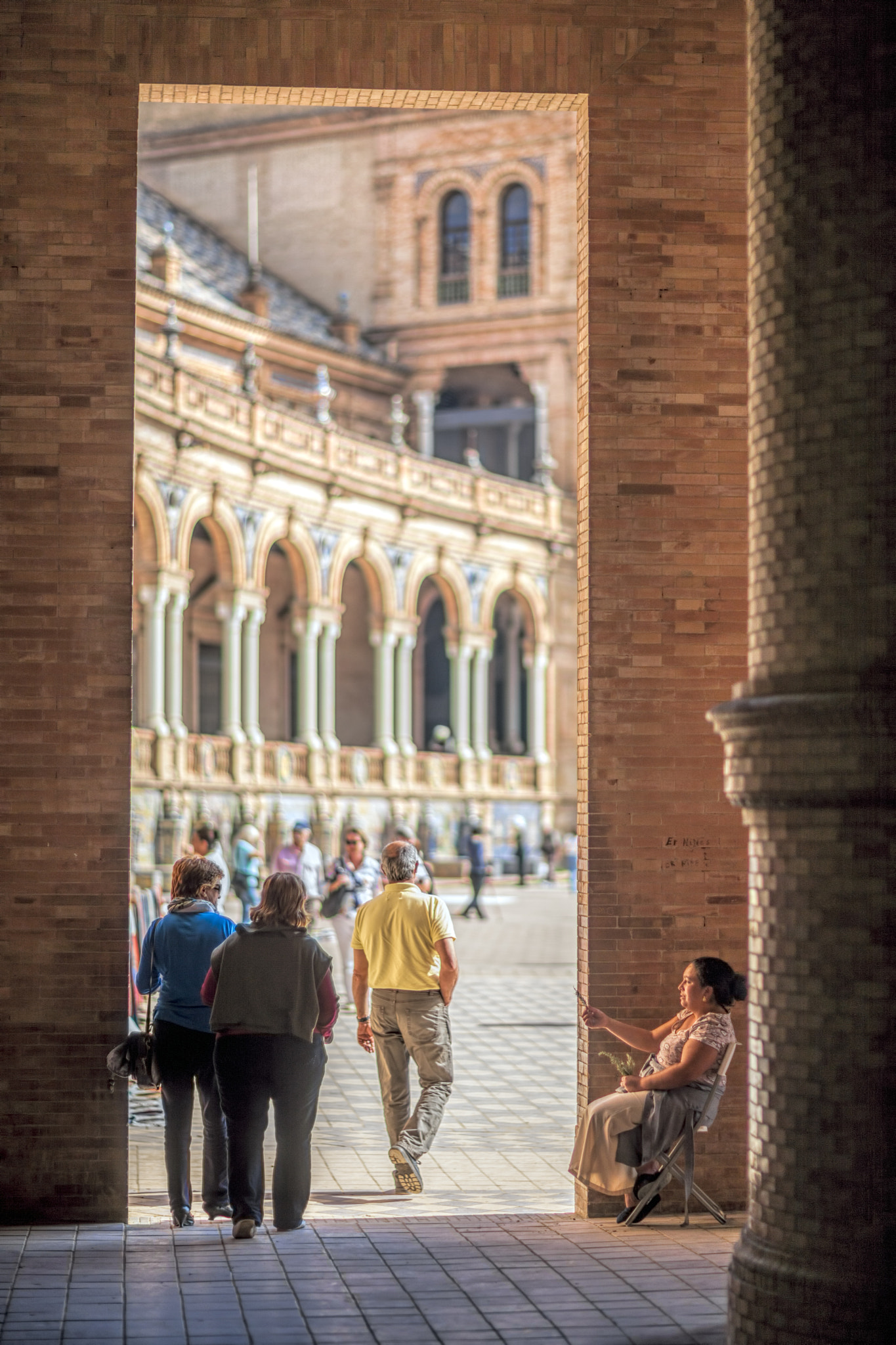 Canon EF 85mm F1.2L II USM sample photo. People entering plaza de españa square, seville photography