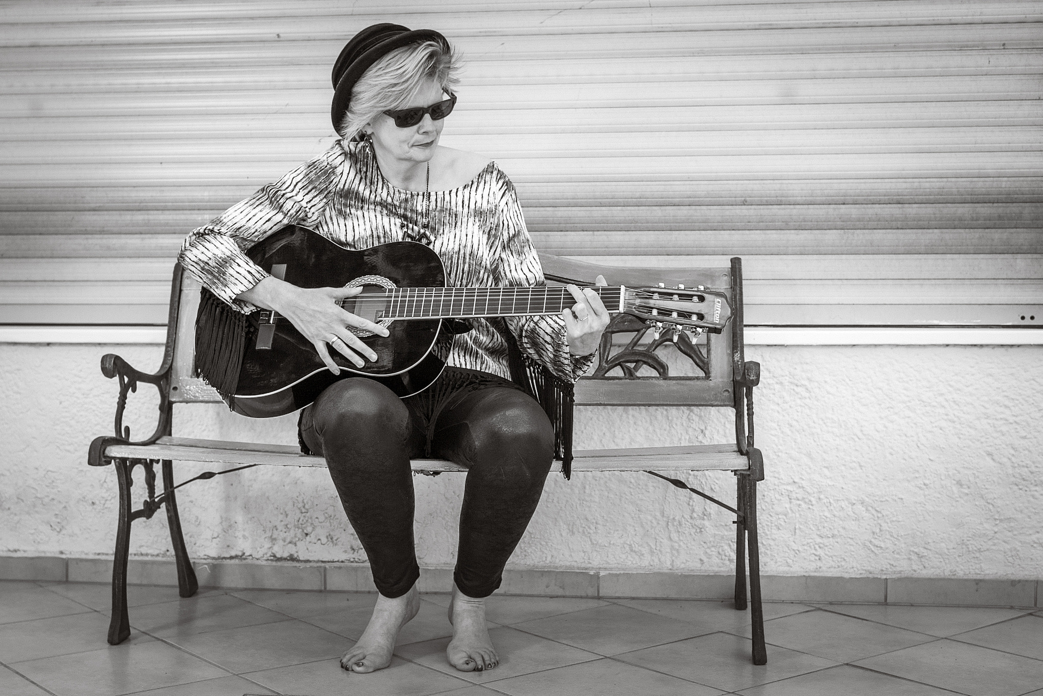 Canon EF 35mm F2 IS USM sample photo. Music on a bench... photography