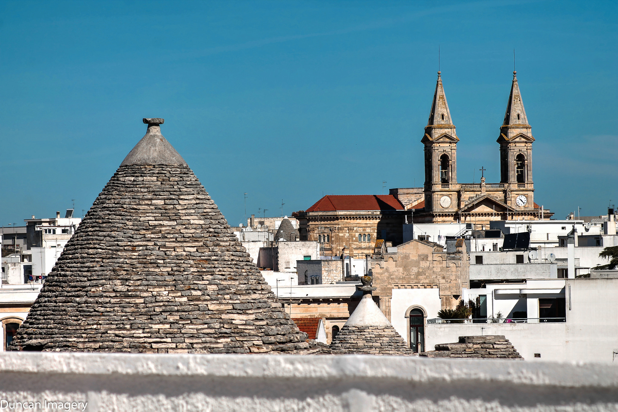 Canon EF 80-200mm F4.5-5.6 II sample photo. Alberobello rooftop view photography