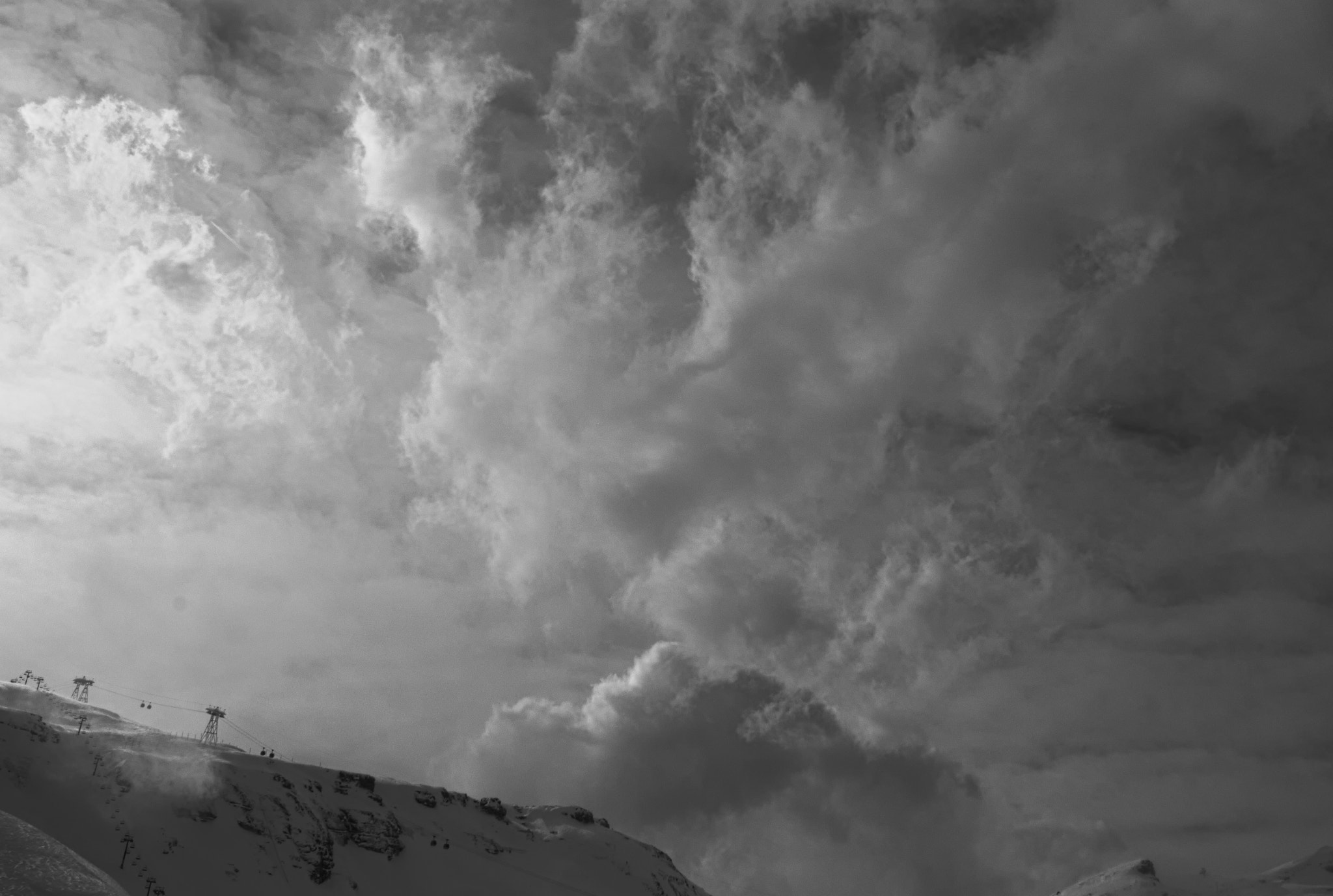 Canon EF-S 18-55mm F3.5-5.6 II sample photo. Flaine ski station - sun through cloud photography