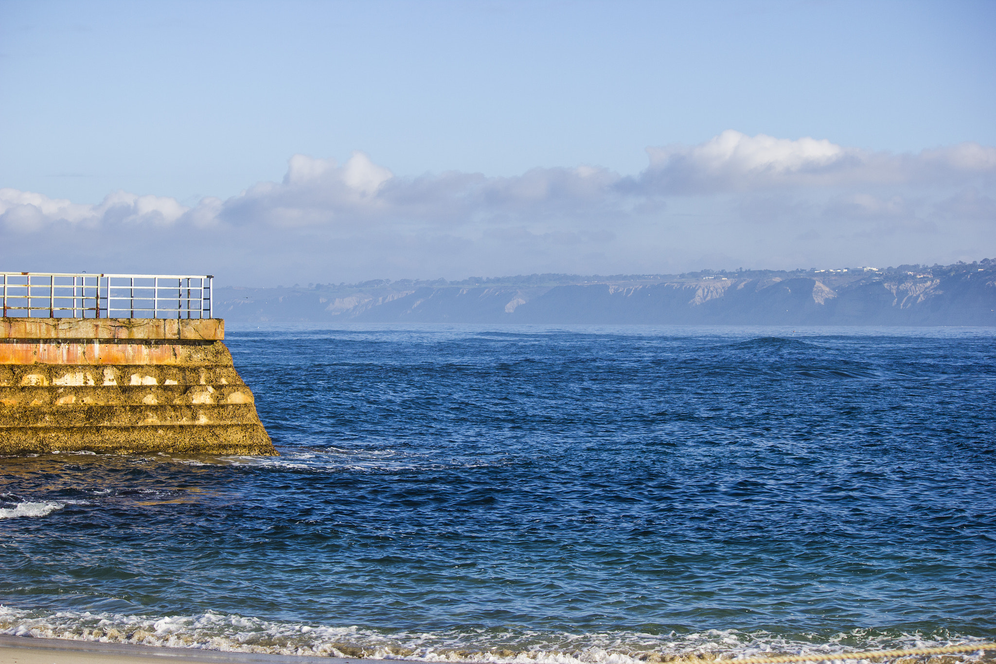 Canon EF-S 55-250mm F4-5.6 IS sample photo. Ocean sea wall photography