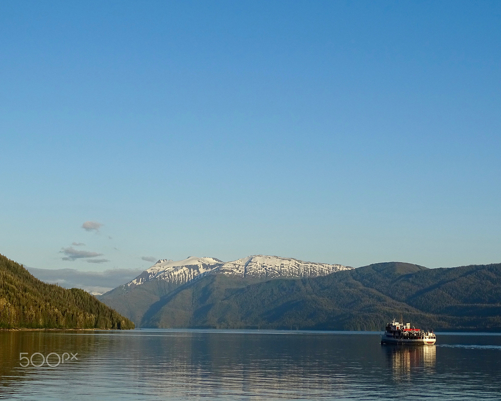 Sony 24-210mm F2.8-6.3 sample photo. Boat, sky and mountains, leaving endicott arm photography