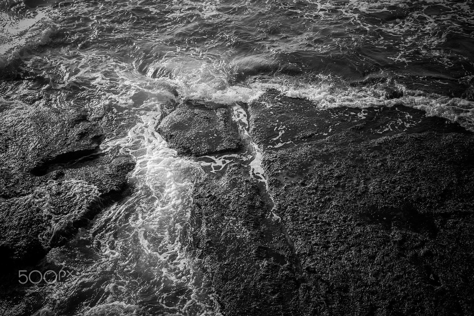 Canon EF-S 17-55mm F2.8 IS USM sample photo. White sea foam and black rocks surface photography