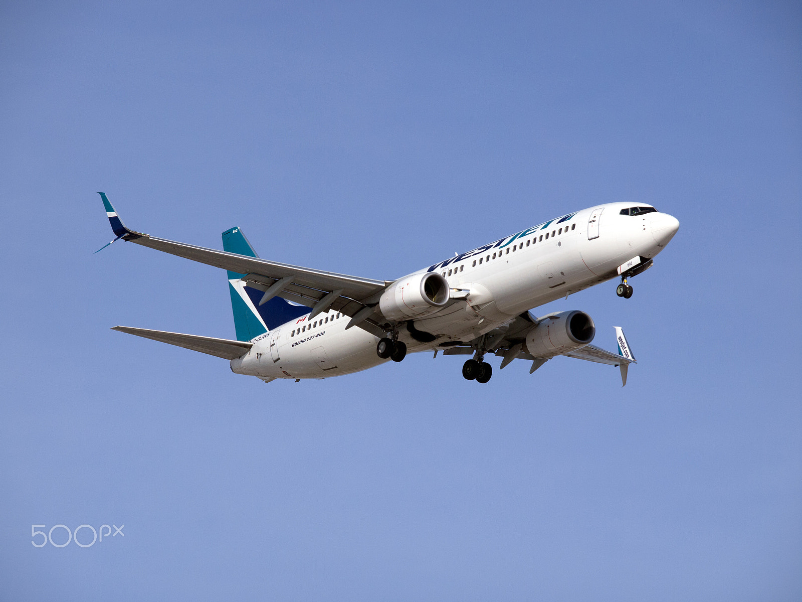 Olympus E-5 + Olympus Zuiko Digital ED 50-200mm F2.8-3.5 SWD sample photo. Westjet boeing b-737-800 photography