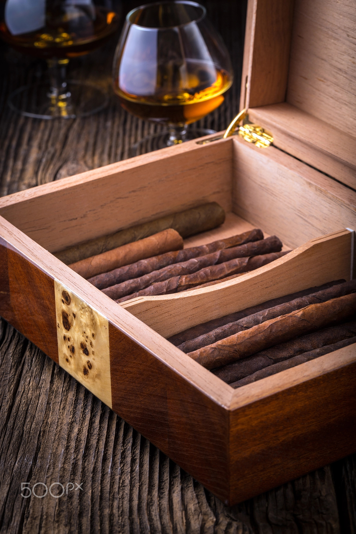 humidor with quality cigar and cognac