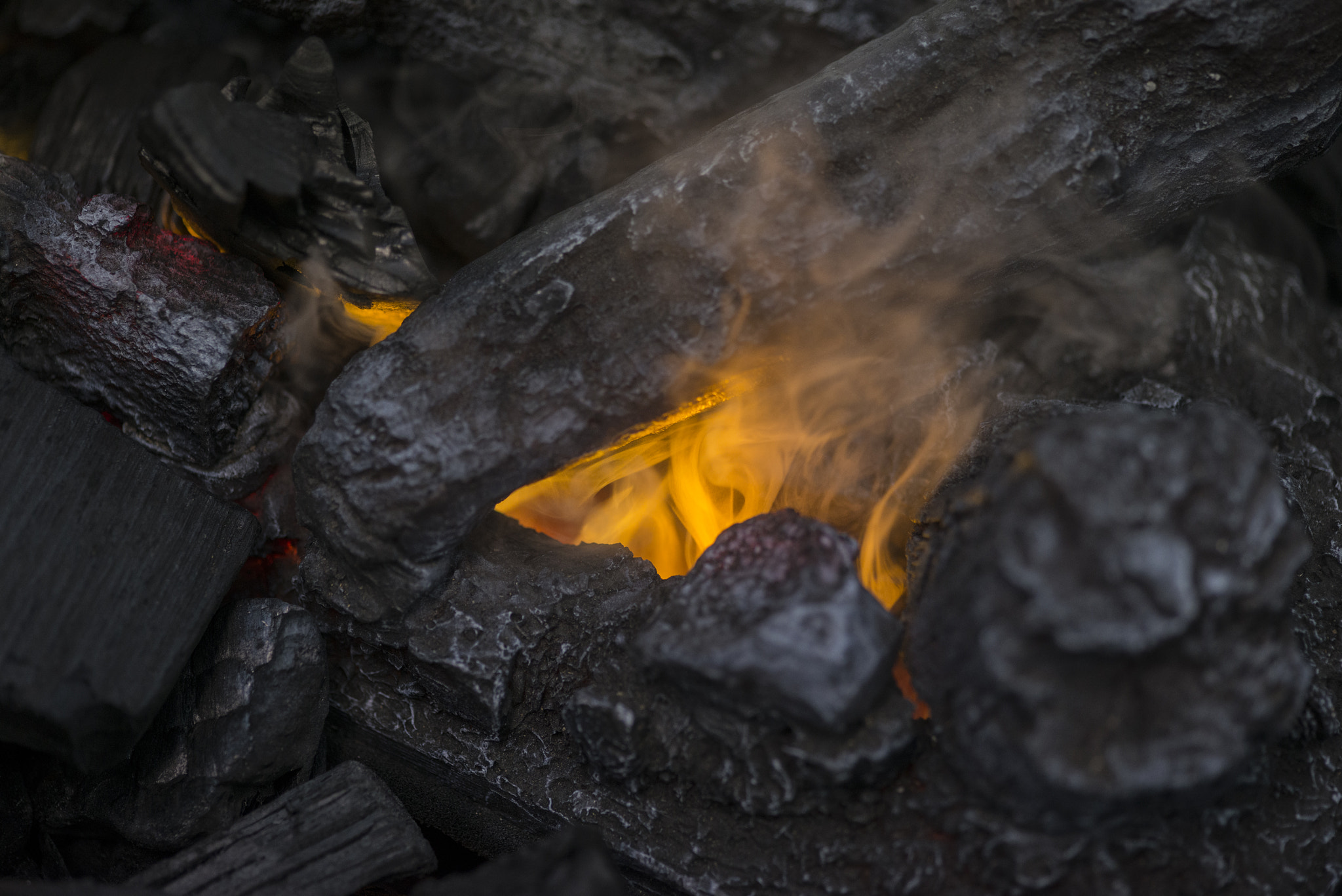Nikon D800 + Sigma 105mm F2.8 EX DG Macro sample photo. Close up of flames in log fire in cozy warm winter fireplace photography