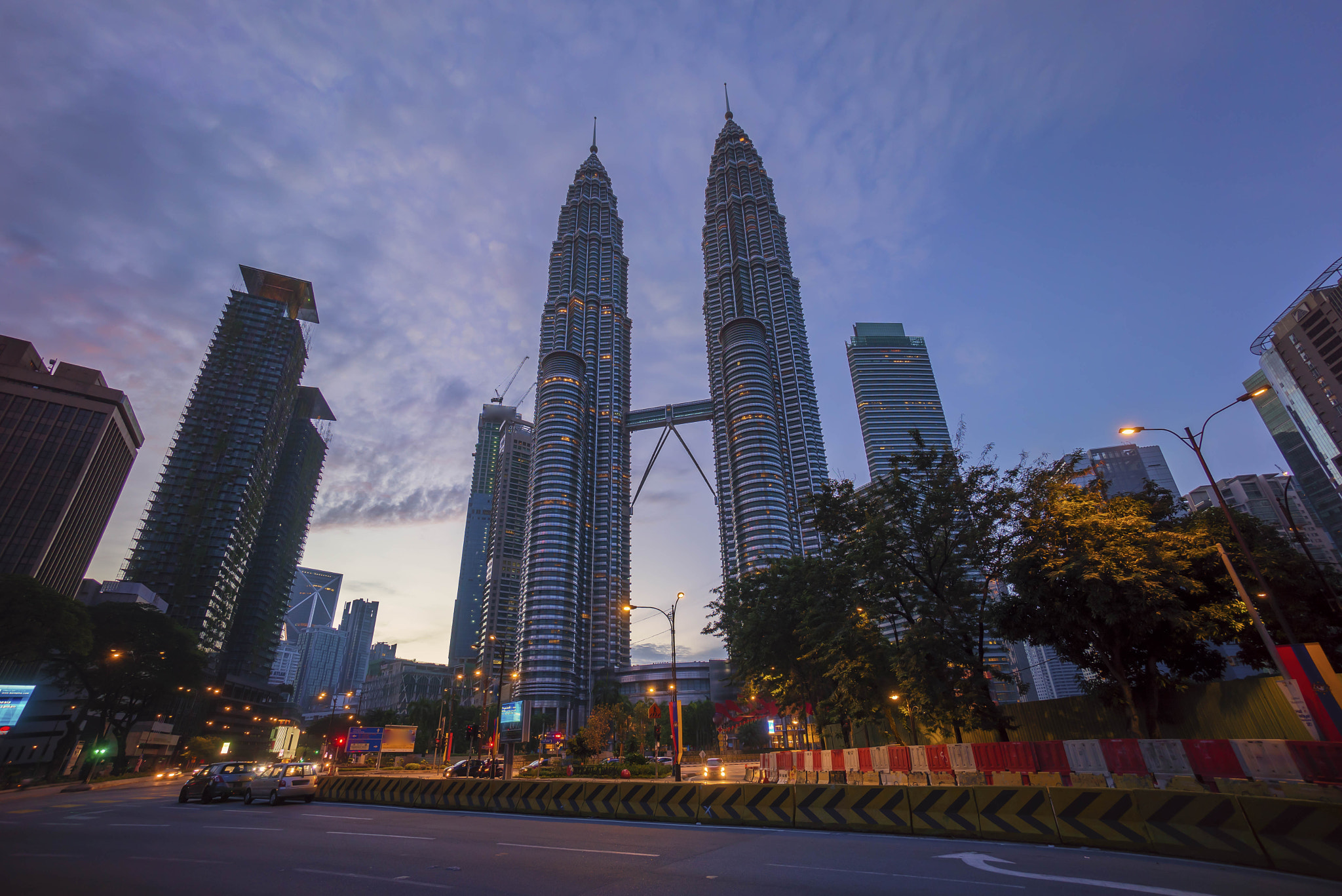 Sony a7R + Sony E 10-18mm F4 OSS sample photo. Road junction at suria klcc petronas twin tower photography