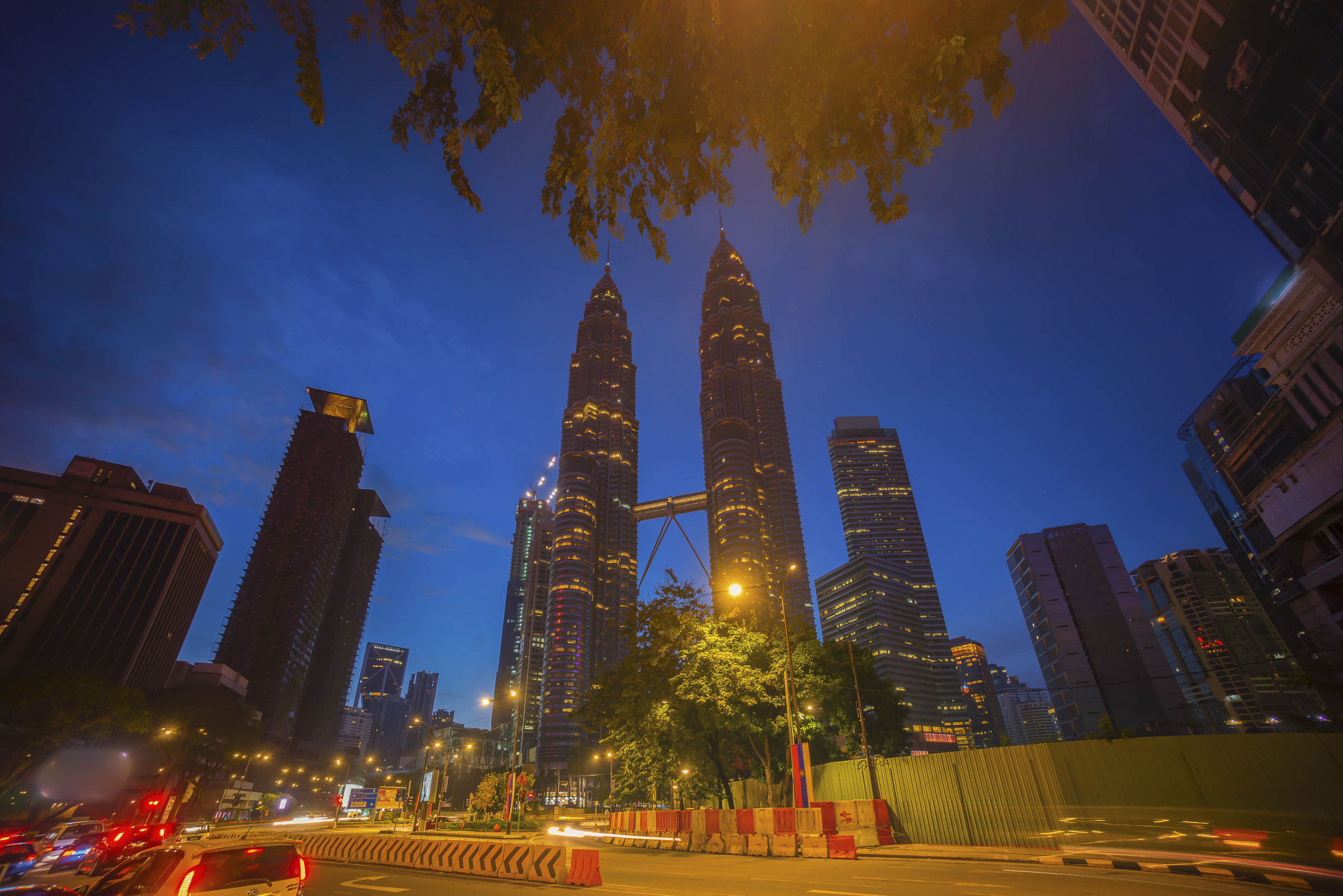 Sony a7R + Sony E 10-18mm F4 OSS sample photo. Road junction at suria klcc petronas twin tower photography