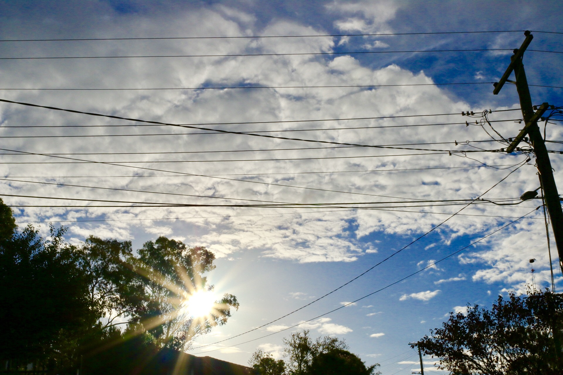 Canon EF 24mm F2.8 IS USM sample photo. Clouds and wires photography