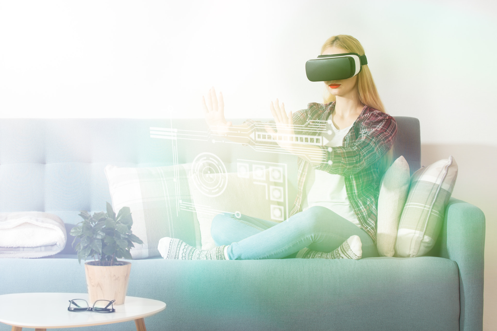 Nikon D810 sample photo. Attractive woman wearing virtual reality glasses sitting on a couch. virtual reality headset.... photography