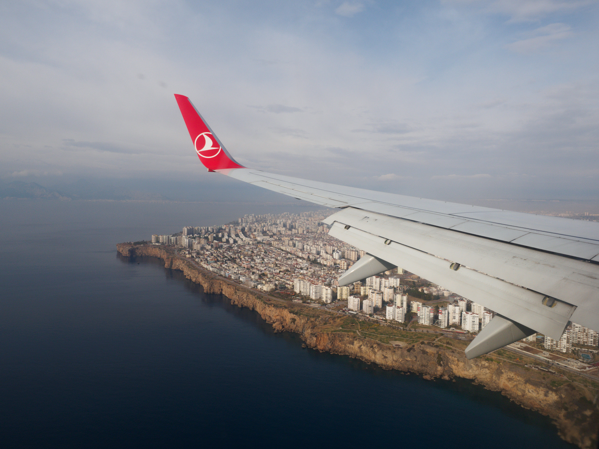 Olympus OM-D E-M10 + Olympus M.Zuiko Digital ED 12-40mm F2.8 Pro sample photo. Wing-covered city photography