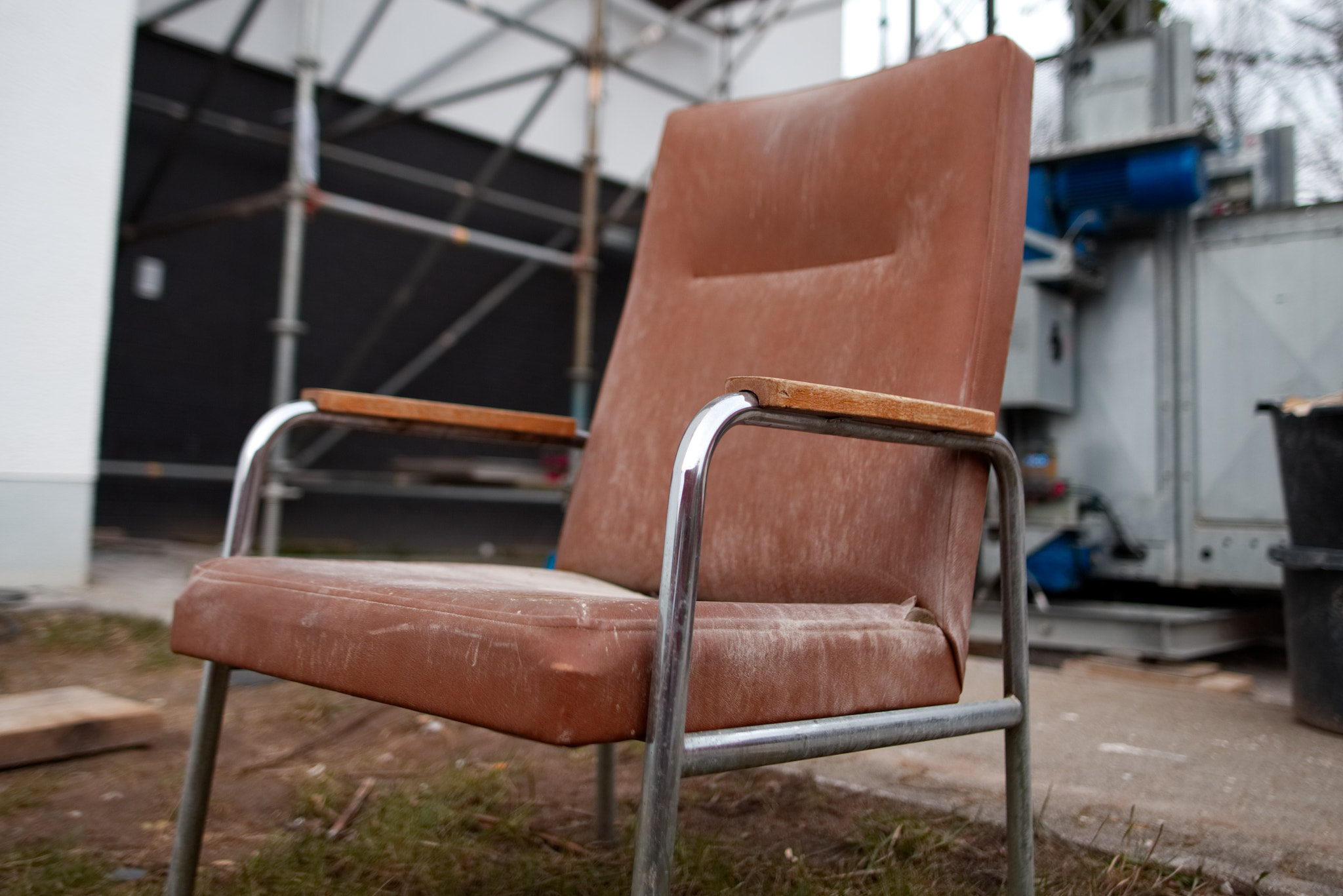 Sigma 28mm f/1.8 DG Macro EX sample photo. Hospital chair in construction site photography