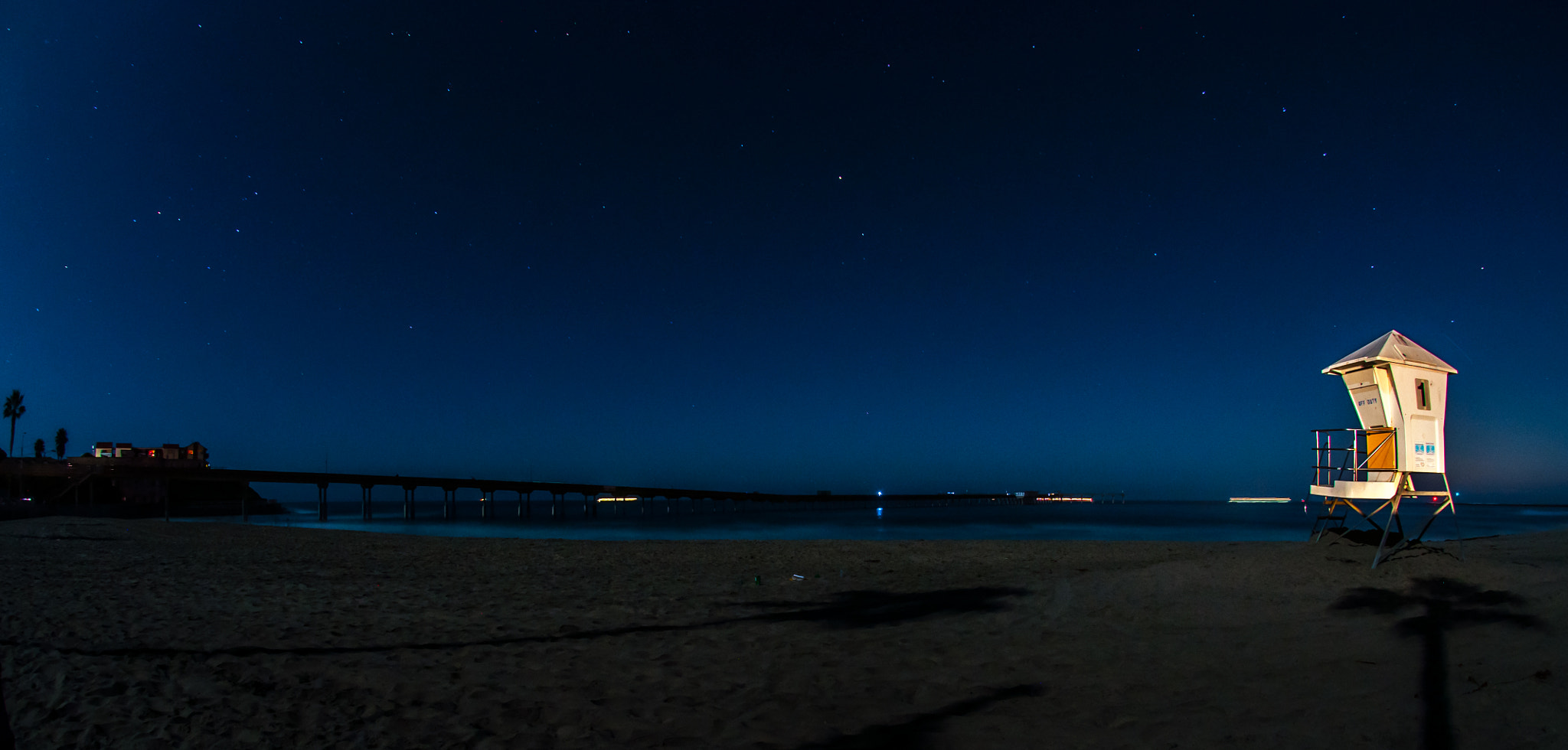 Nikon AF DX Fisheye-Nikkor 10.5mm F2.8G ED sample photo. Lifeguard tower and pier photography