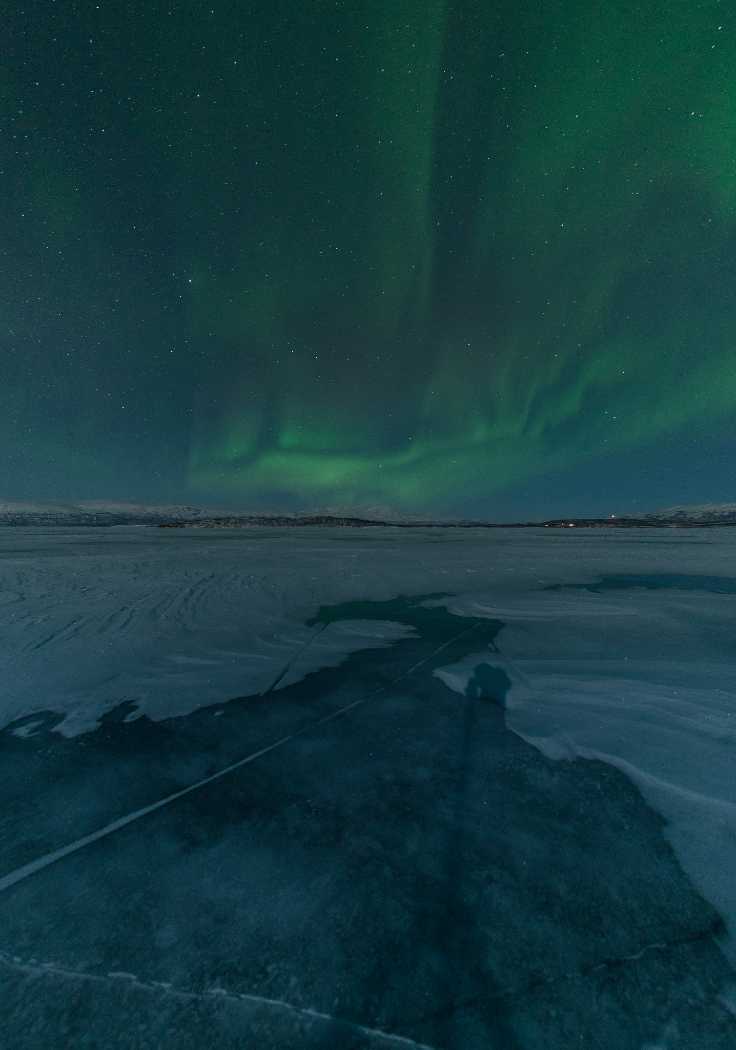 Nikon D610 + Sigma 12-24mm F4.5-5.6 II DG HSM sample photo. Aurora borealis above a frozen lake photography