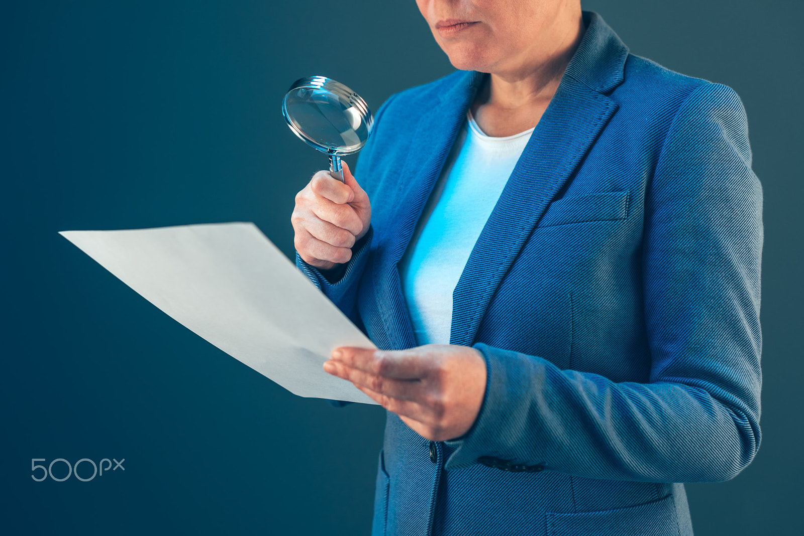 Nikon D810 + Nikon AF-S Nikkor 50mm F1.4G sample photo. Female tax inspector looking at document with magnifying glass photography