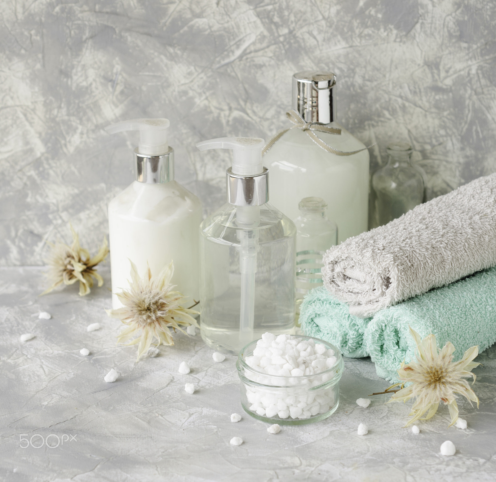 Nikon AF-S DX Micro Nikkor 40mm F2.8 sample photo. Spa set on a white marble table with a stack of towels, selective focus photography