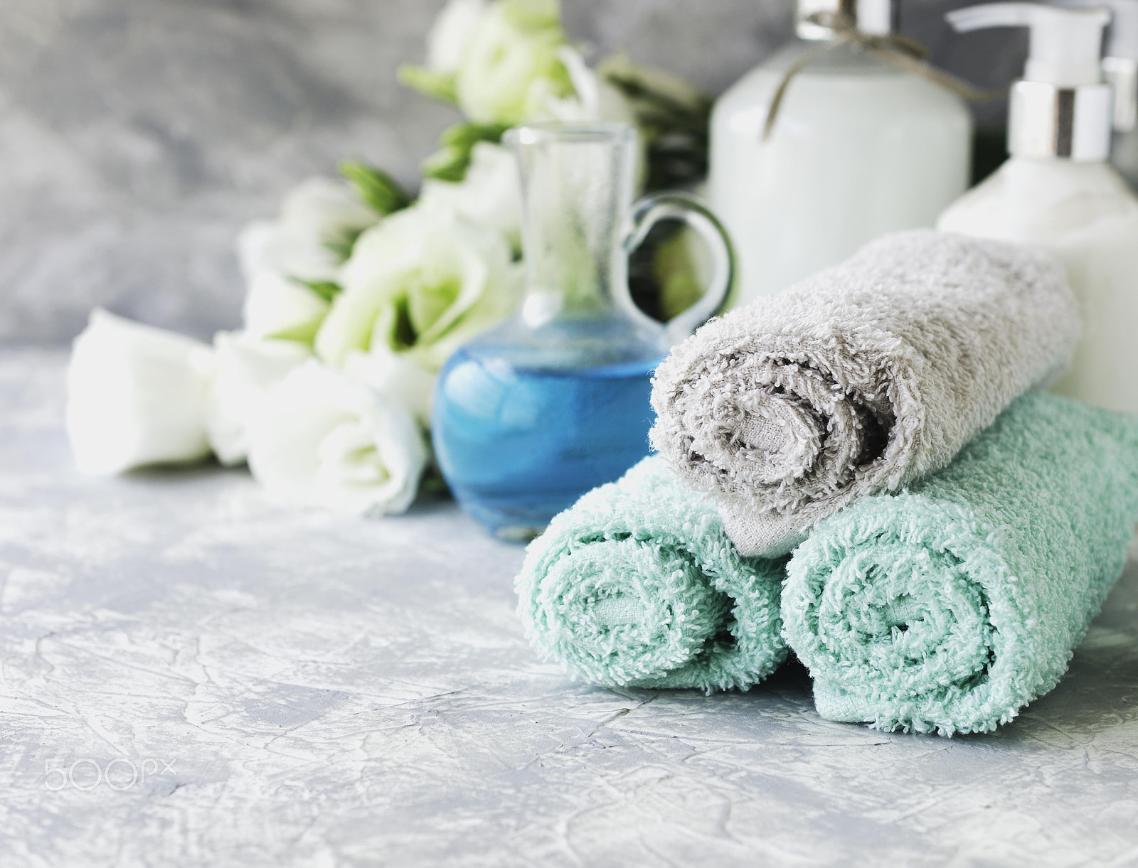 Nikon AF-S DX Micro Nikkor 40mm F2.8 sample photo. Spa set on a white marble table with a stack of towels, selective focus photography