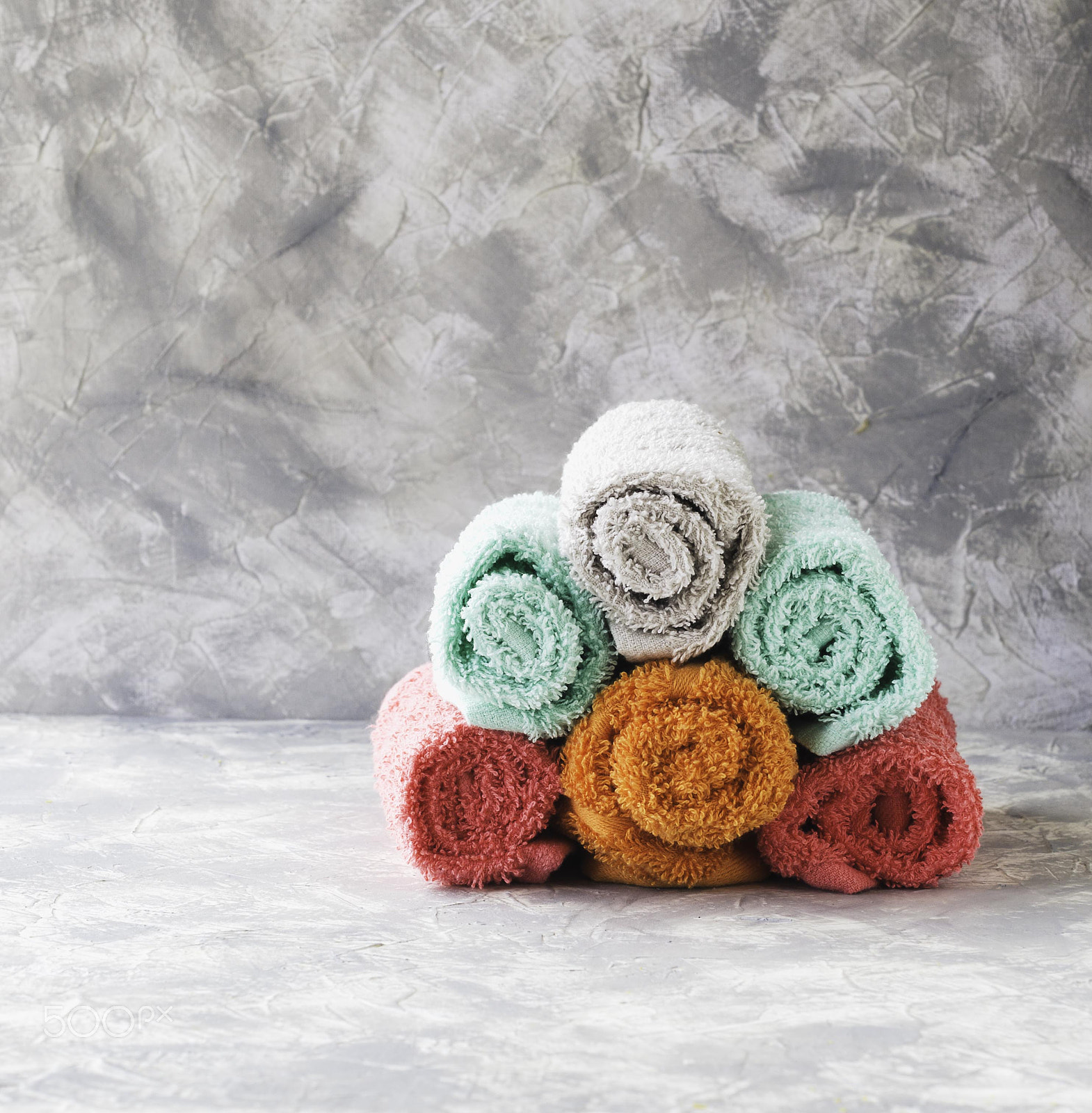 Nikon AF-S DX Micro Nikkor 40mm F2.8 sample photo. Stack of towels on a marble table, a space under the text, selective focus photography