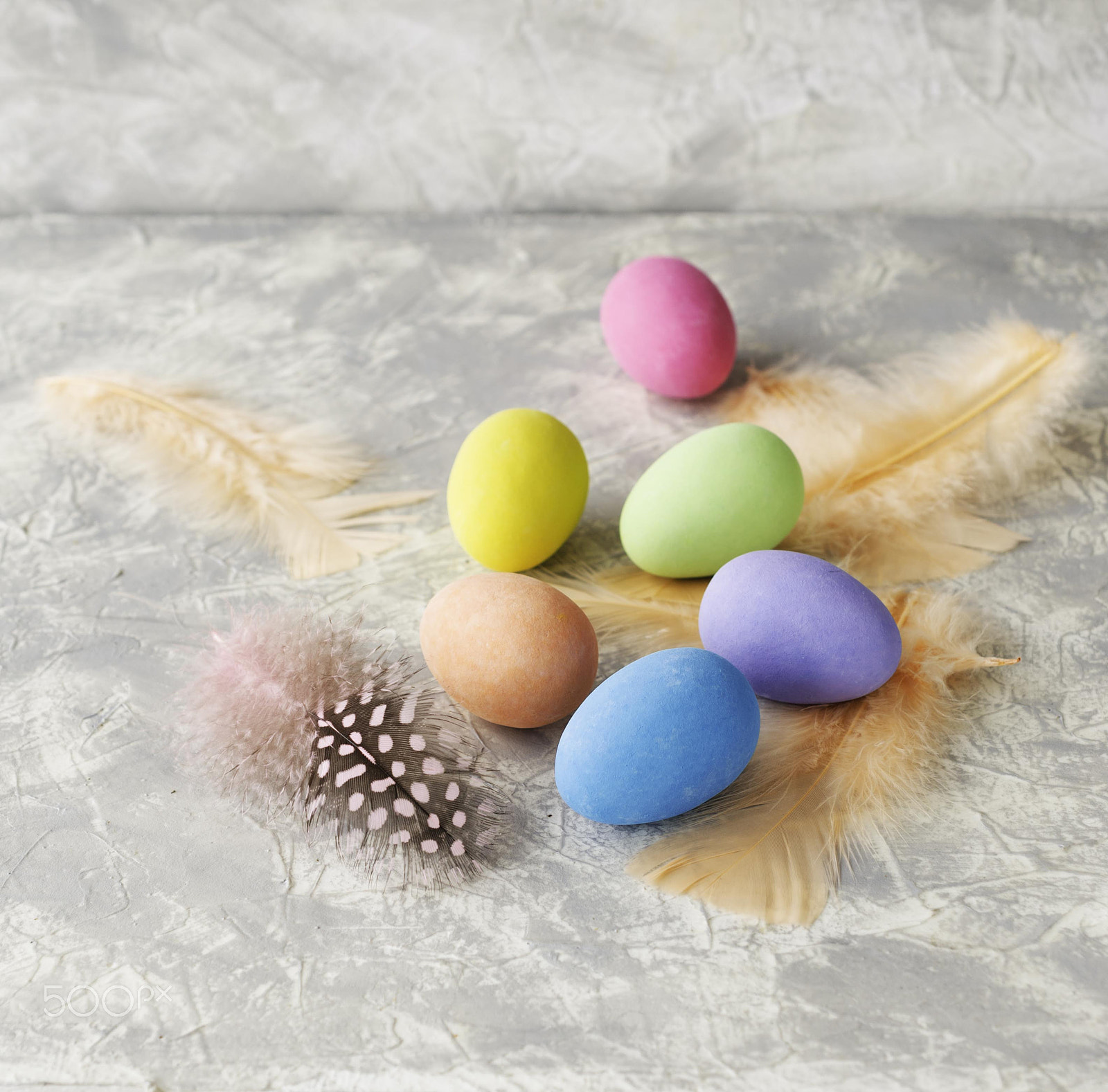 Nikon AF-S DX Micro Nikkor 40mm F2.8 sample photo. Colored easter eggs with feathers on a marble white table, selective focus photography