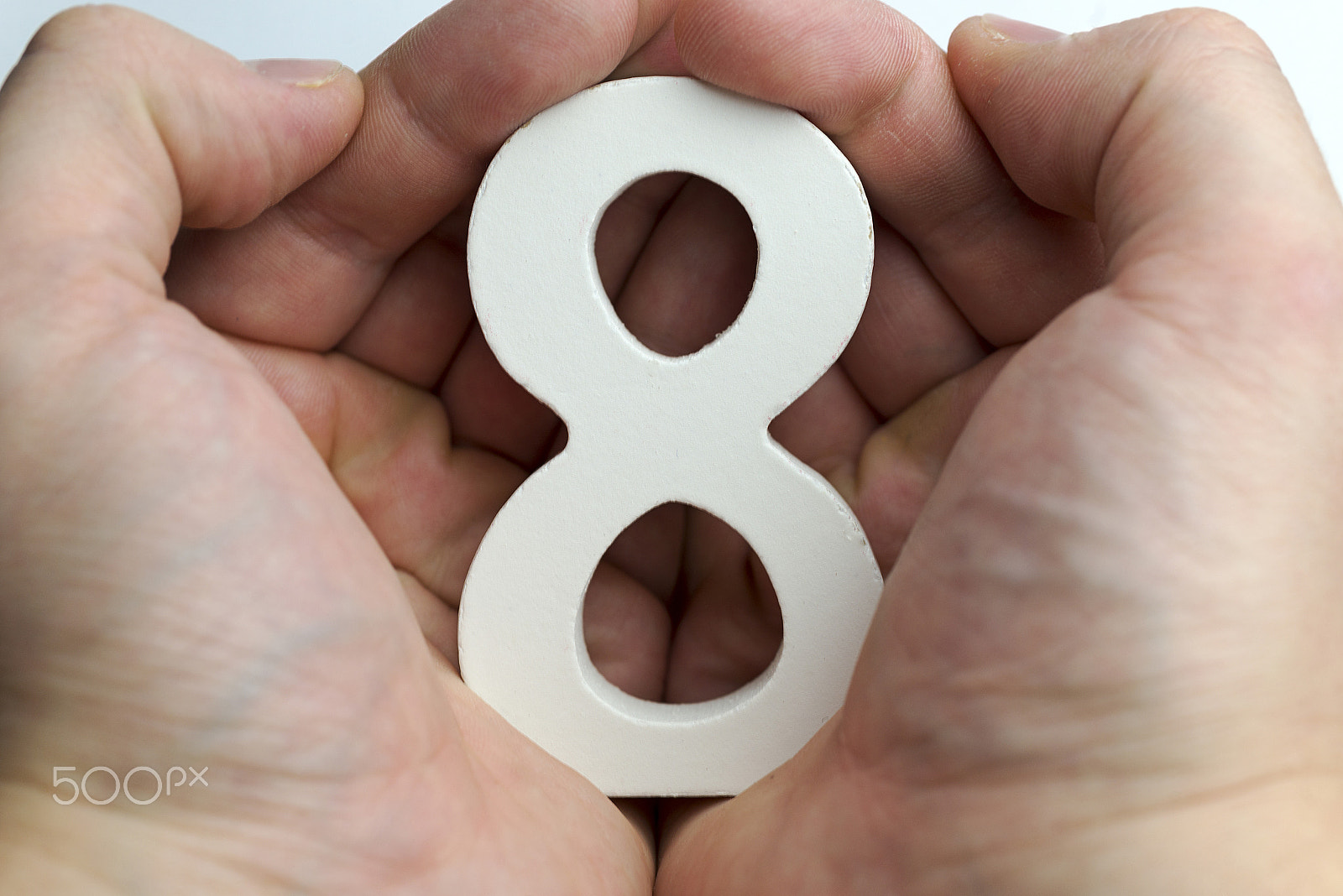 Nikon D600 + Nikon AF Micro-Nikkor 60mm F2.8D sample photo. Hand holding number eight. photography