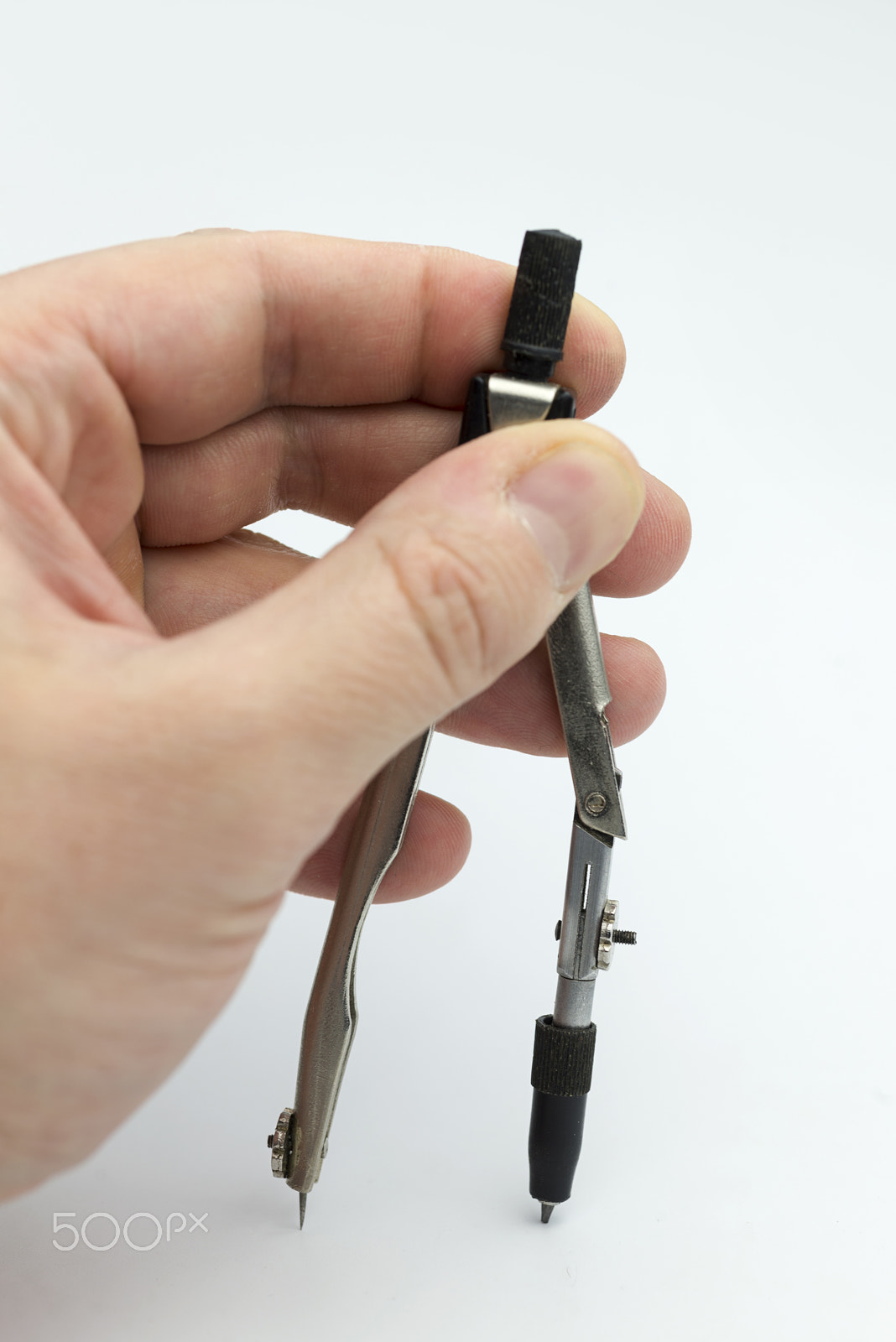 Nikon D600 + Nikon AF Micro-Nikkor 60mm F2.8D sample photo. Hand holds a pair of compasses. photography