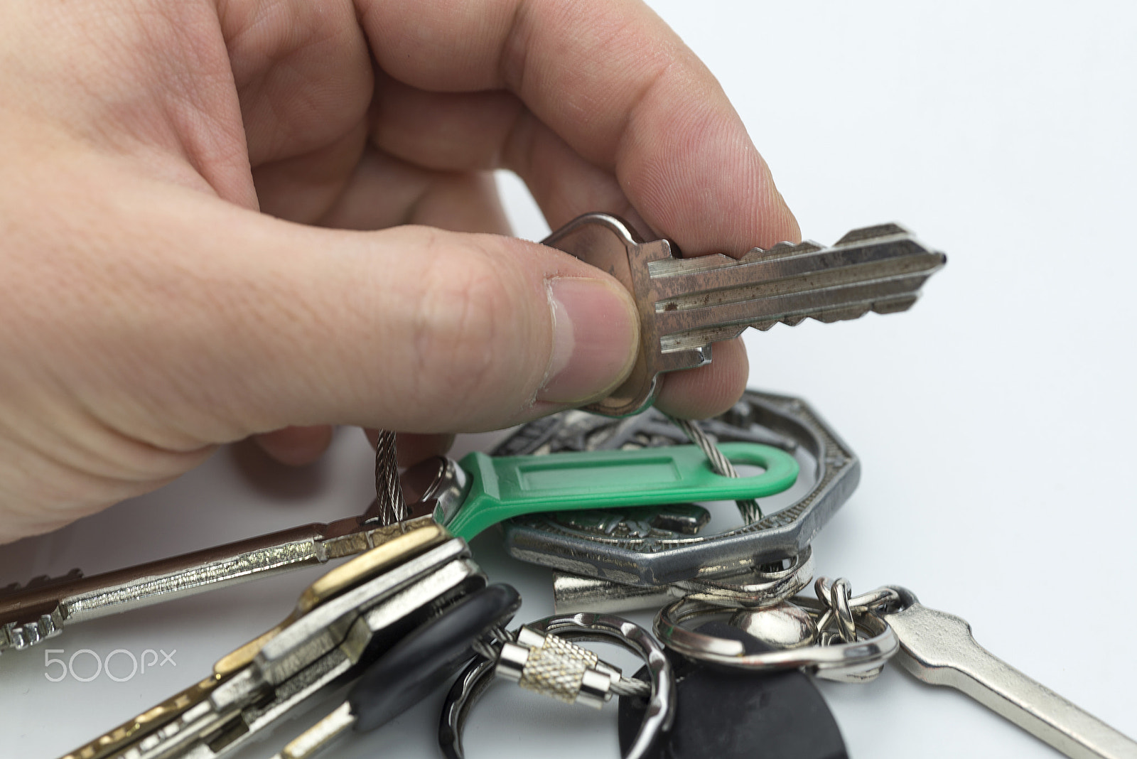Nikon AF Micro-Nikkor 60mm F2.8D sample photo. Hand holds the keys to the apartment. photography