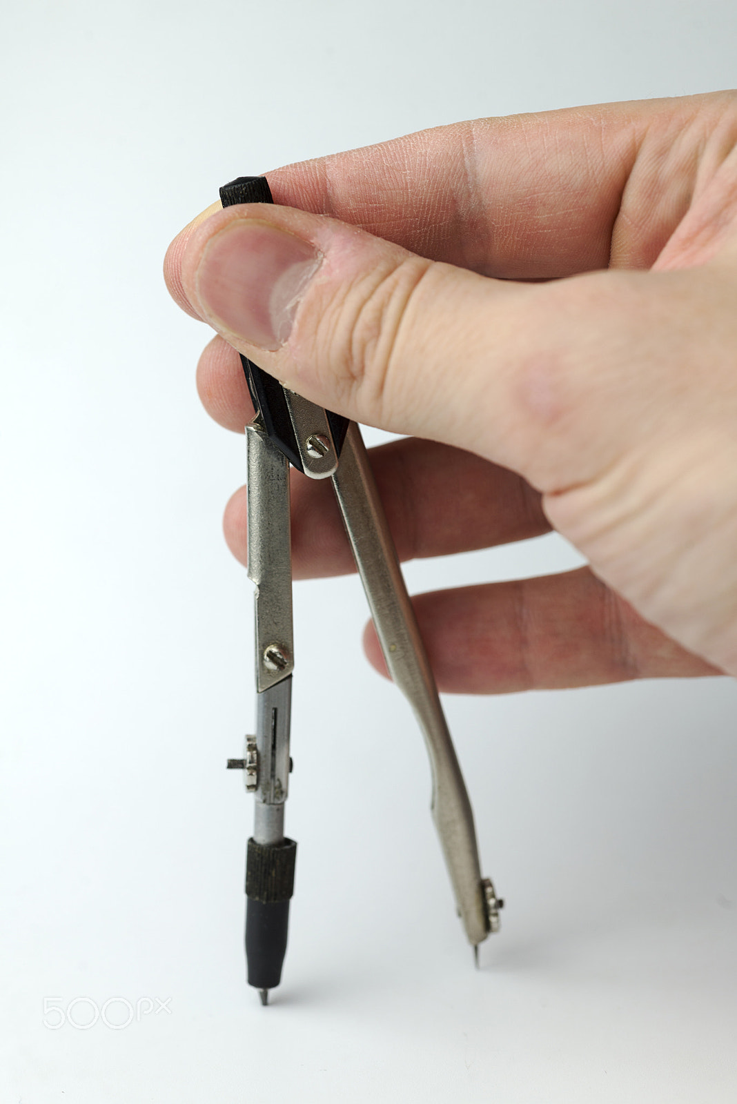 Nikon D600 + Nikon AF Micro-Nikkor 60mm F2.8D sample photo. Hand holds a pair of compasses. photography