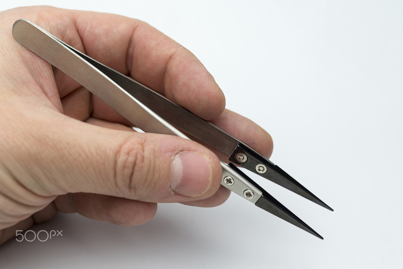 Nikon D600 + Nikon AF Micro-Nikkor 60mm F2.8D sample photo. Hand holding a pair of tweezers. photography